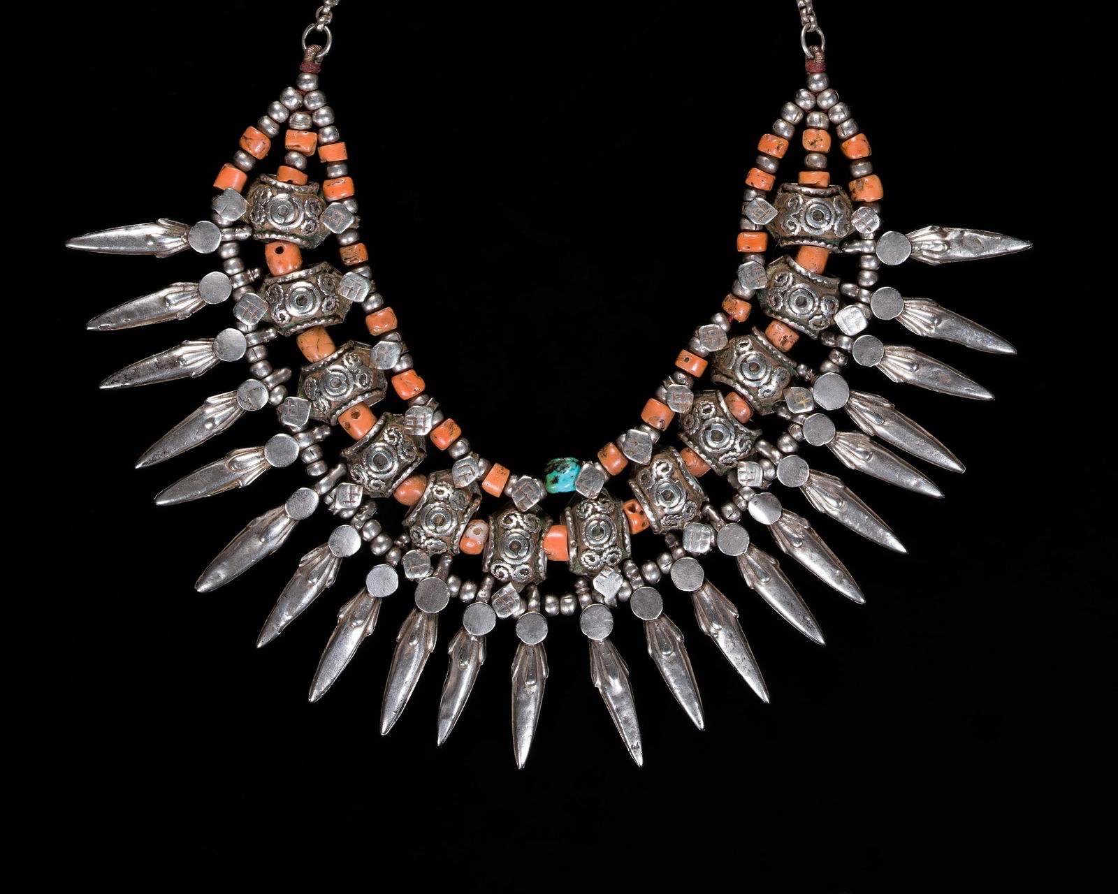 A CORAL, TURQUOISE, AND SILVER BEADED THARU NECKLACE (KANTSHRI), EARLY 20TH CENTURY: A CORAL, TURQUOISE, AND SILVER BEADED THARU NECKLACE (KANTSHRI), EARLY 20TH CENTURY This lot is from a single owner collection and is therefore offered without reserve Nepal. Consisting of three stran