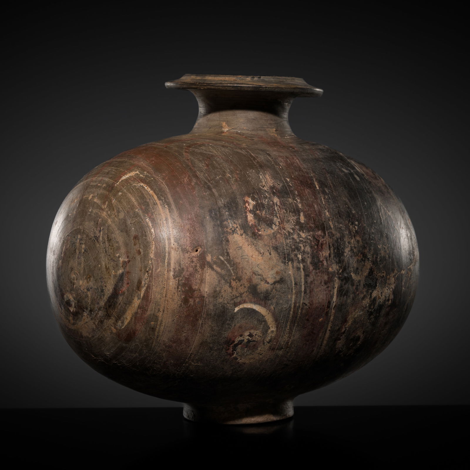 AN ABSTRACTLY PAINTED POTTERY COCOON JAR, HAN DYNASTY (1 of 13)