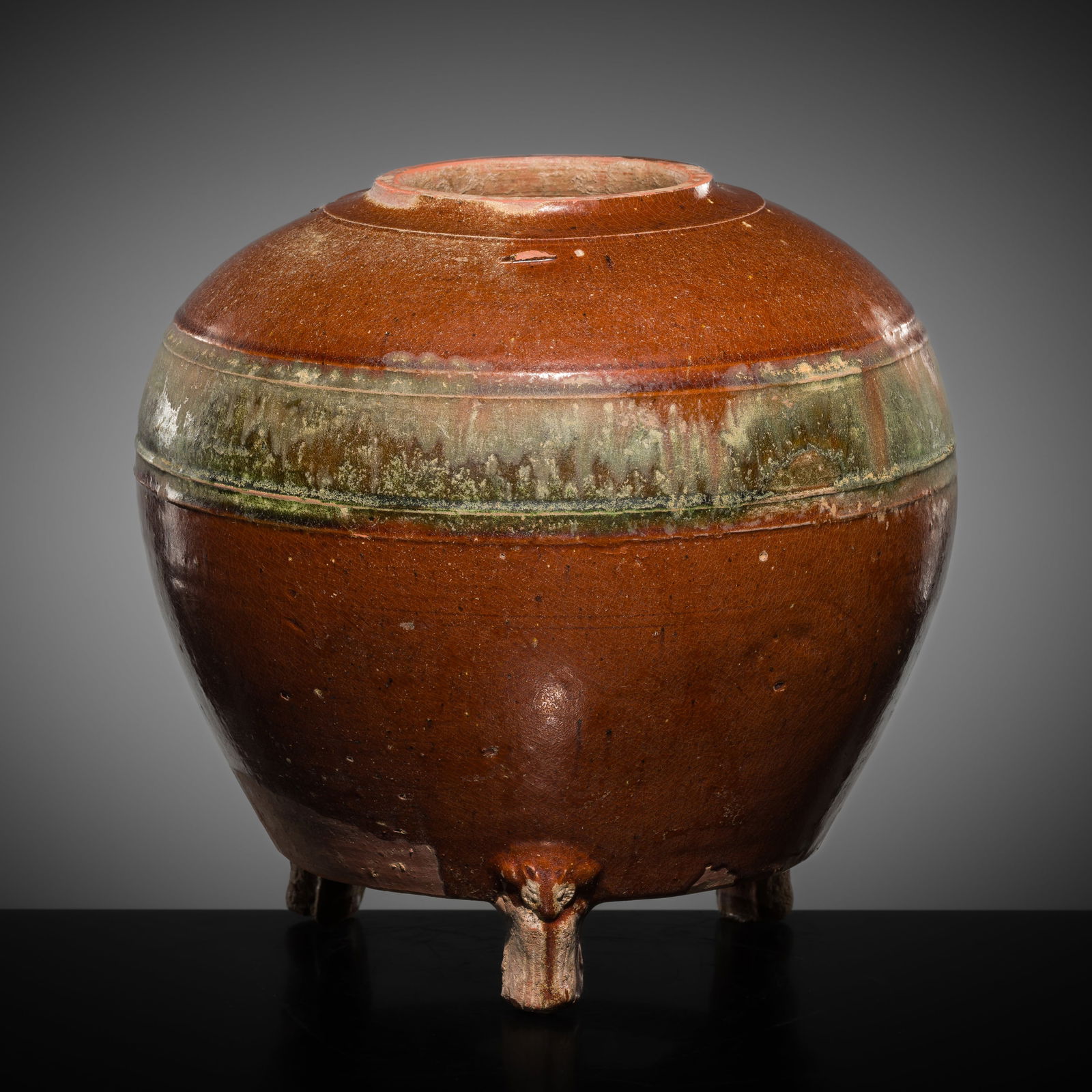 A BROWN AND GREEN GLAZED POTTERY TRIPOD JAR WITH BEAR SHAPE FEET, HAN DYNASTY (1 of 12)
