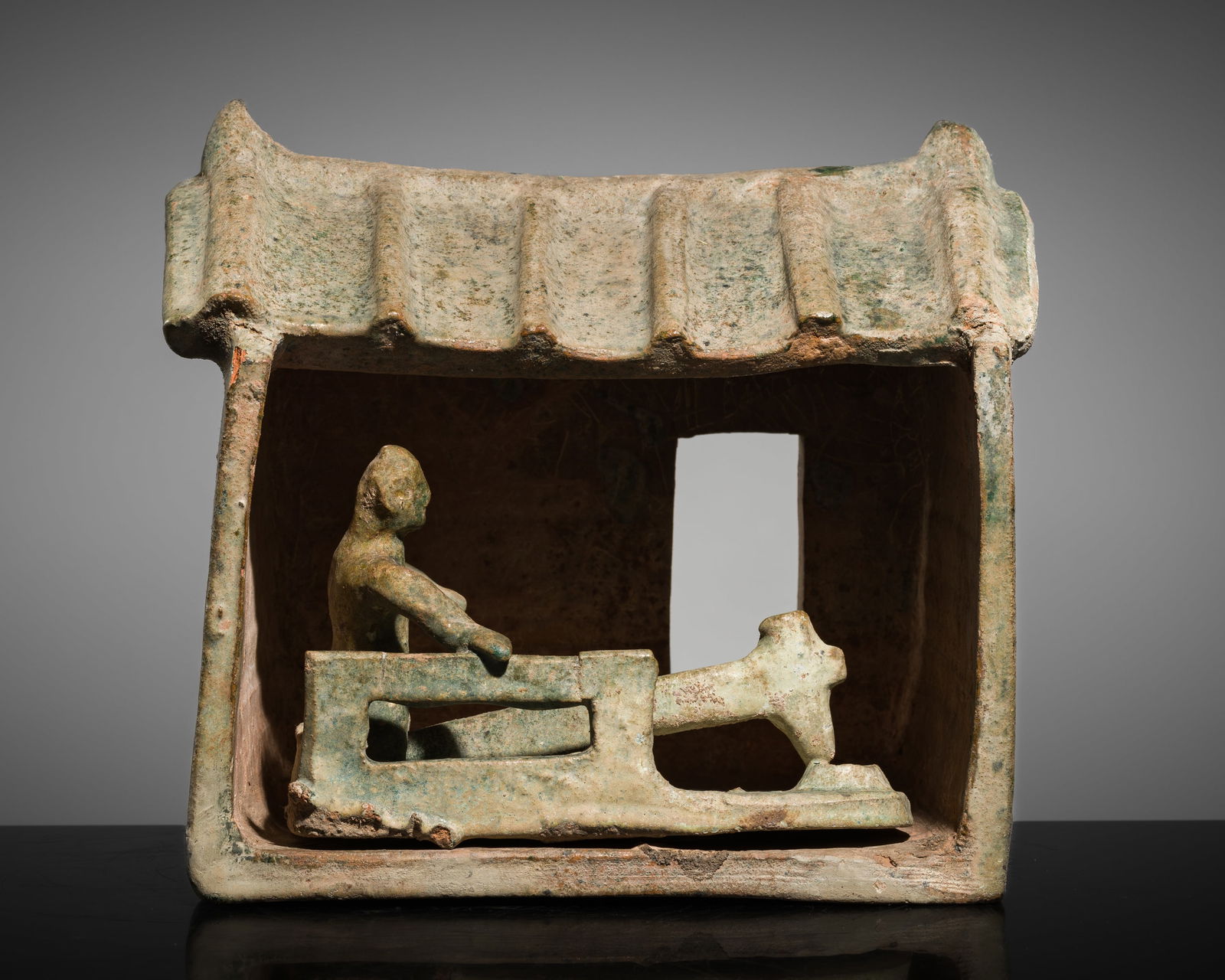 A GREEN-GLAZED POTTERY MODEL OF A MILLHOUSE, HAN DYNASTY (1 of 13)