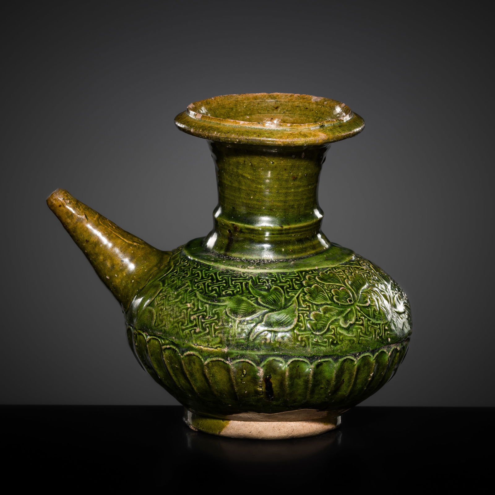 A CARVED GREEN-GLAZED POTTERY POURING VESSEL (KENDI), TANG TO SONG DYNASTY (1 of 15)