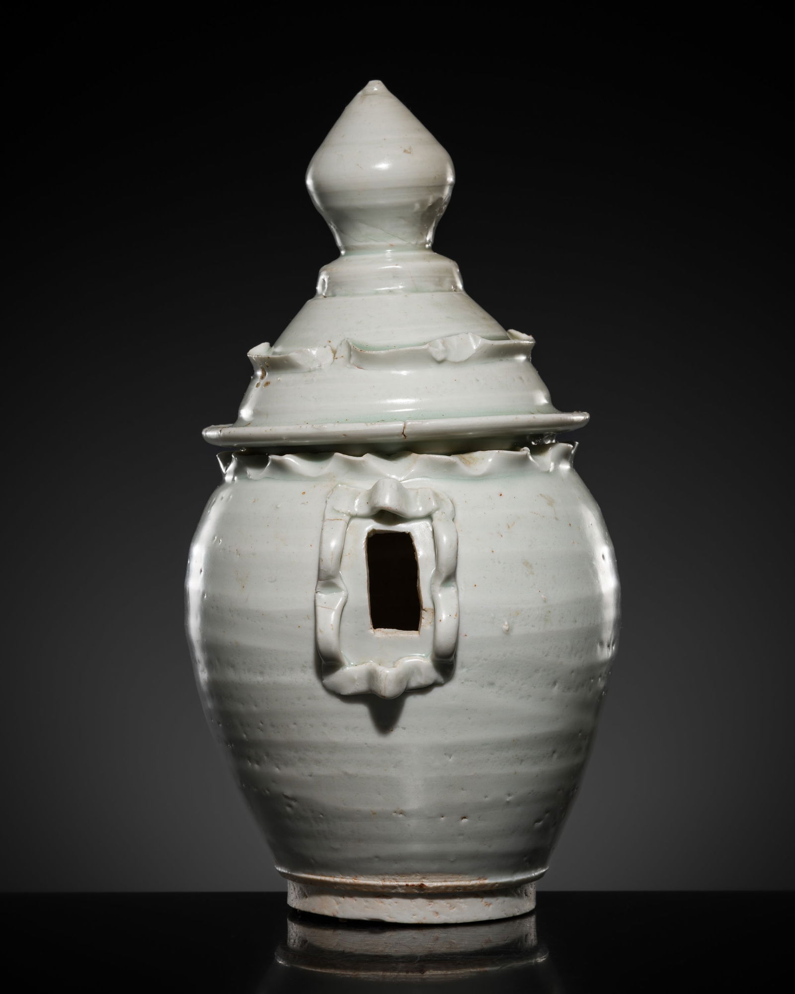 A QINGBAI-GLAZED MODEL OF A GRANARY, SONG DYNASTY: A QINGBAI-GLAZED MODEL OF A GRANARY, SONG DYNASTY This lot is from a single owner collection and is therefore offered without reserve China, 960-1279. The thick-walled ovoid body of the grain storehou