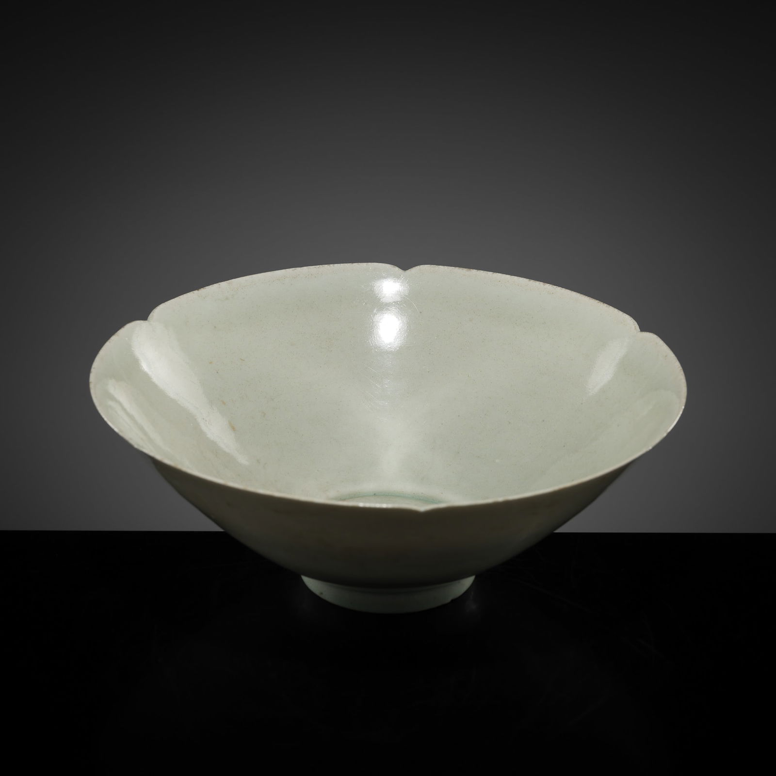 A LOBED QINGBAI GLAZED BOWL, SOUTHERN SONG DYNASTY: A LOBED QINGBAI GLAZED BOWL, SOUTHERN SONG DYNASTY This lot is from a single owner collection and is therefore offered without reserve China, 1127-1279. Finely potted with slightly rounded sides ri