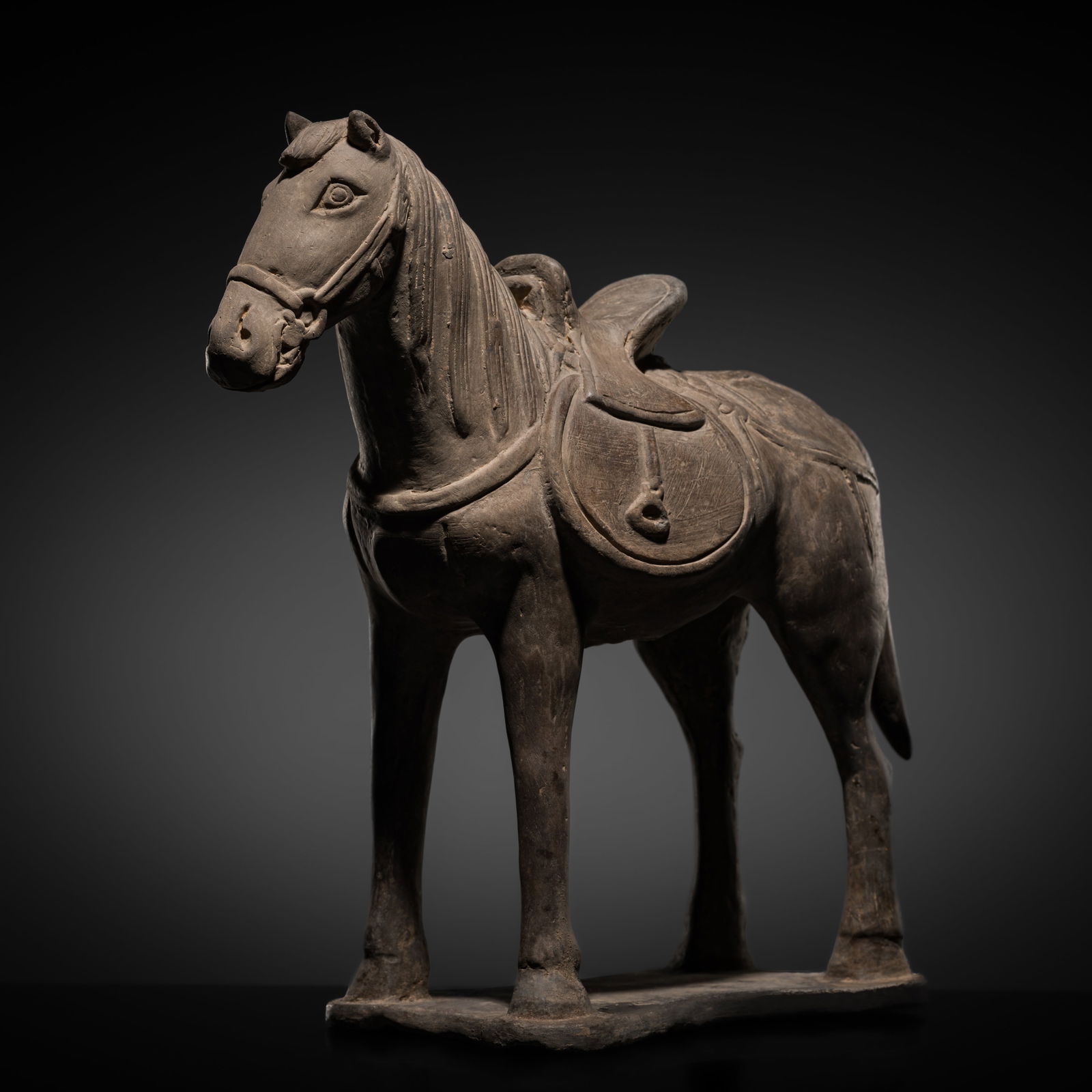 A GRAY POTTERY FIGURE OF A HORSE, YUAN DYNASTY (1 of 11)