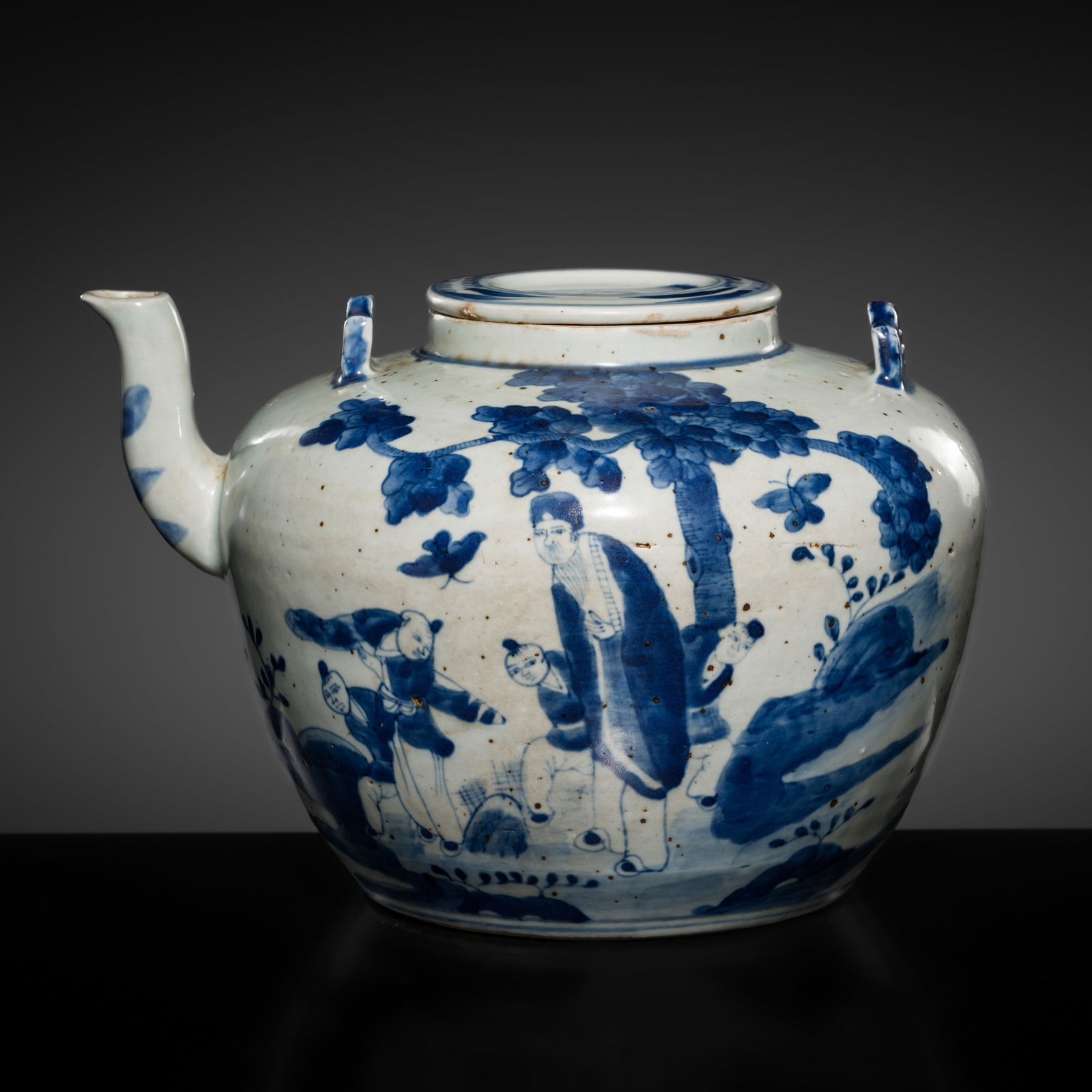 A BLUE AND WHITE 'BOYS' TEAPOT AND COVER, EARLY QING DYNAST: A BLUE AND WHITE 'BOYS' TEAPOT AND COVER, EARLY QING DYNAST This lot is from a single owner collection and is therefore offered without reserve China, 1644-1912. Of compressed globular form rising