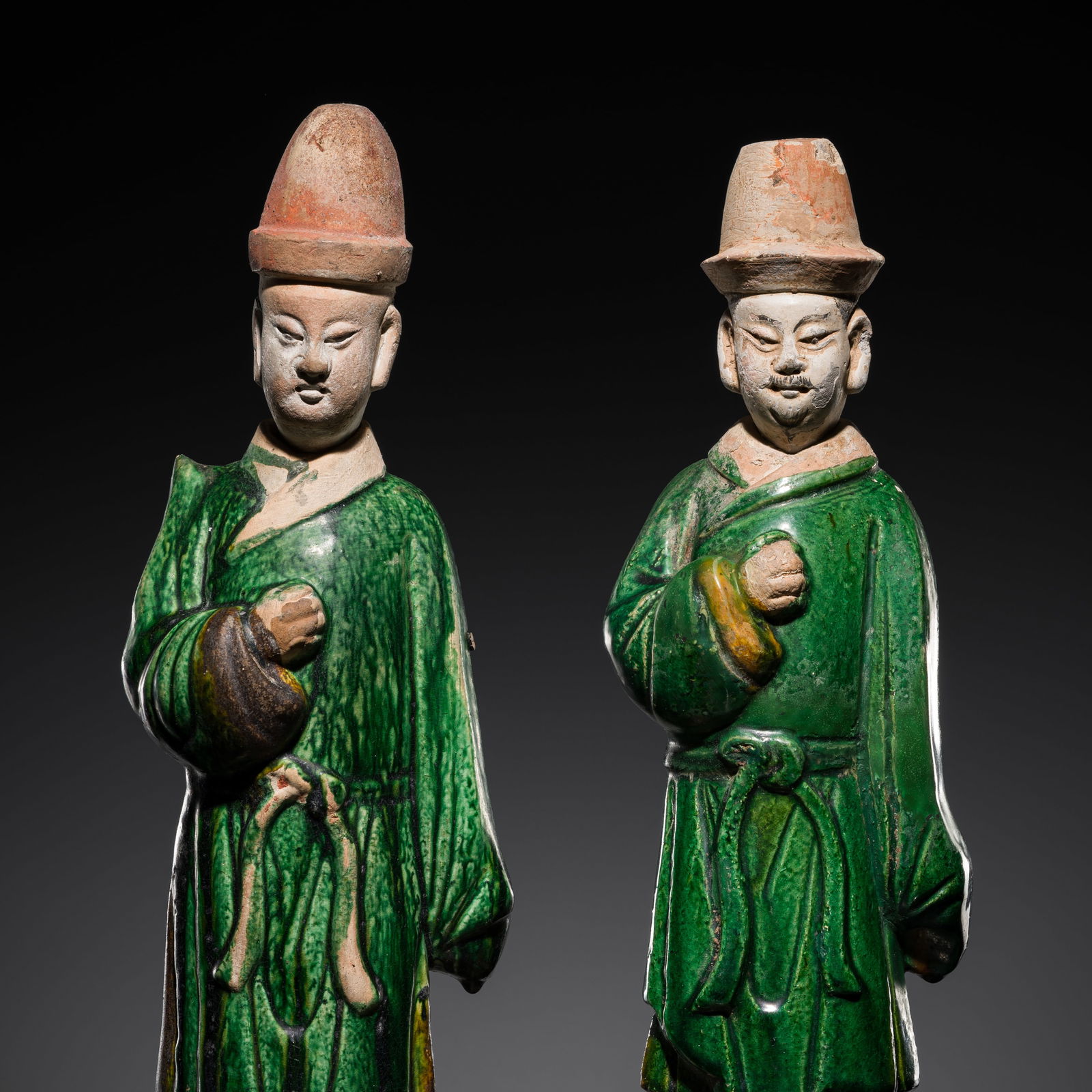 A PAIR OF SANCAI-GLAZED POTTERY FIGURES OF ATTENDANTS, MING DYNASTY (1 of 12)