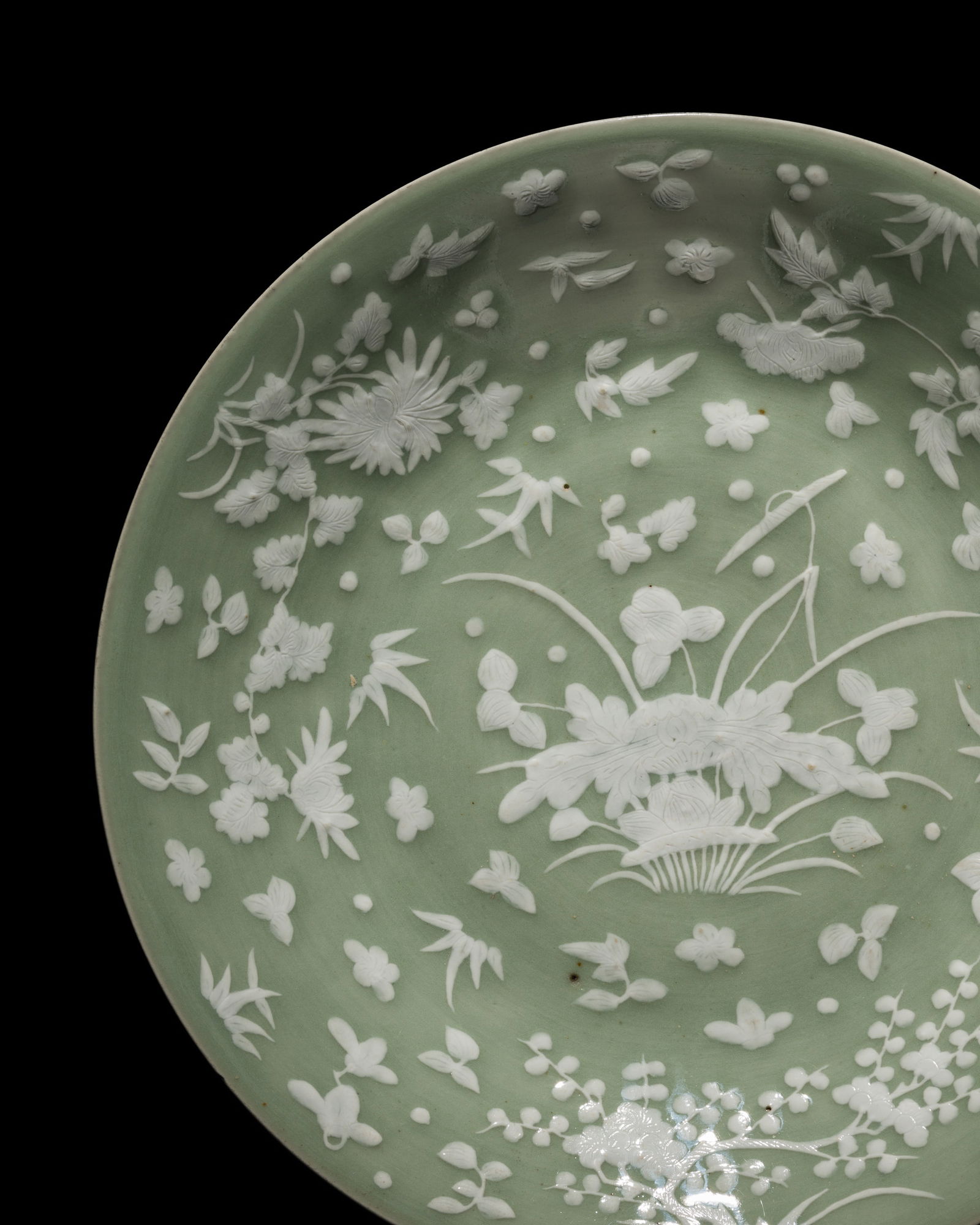 A CELADON-GROUND SLIP-DECORATED DISH, QING DYNASTY (1 of 11)