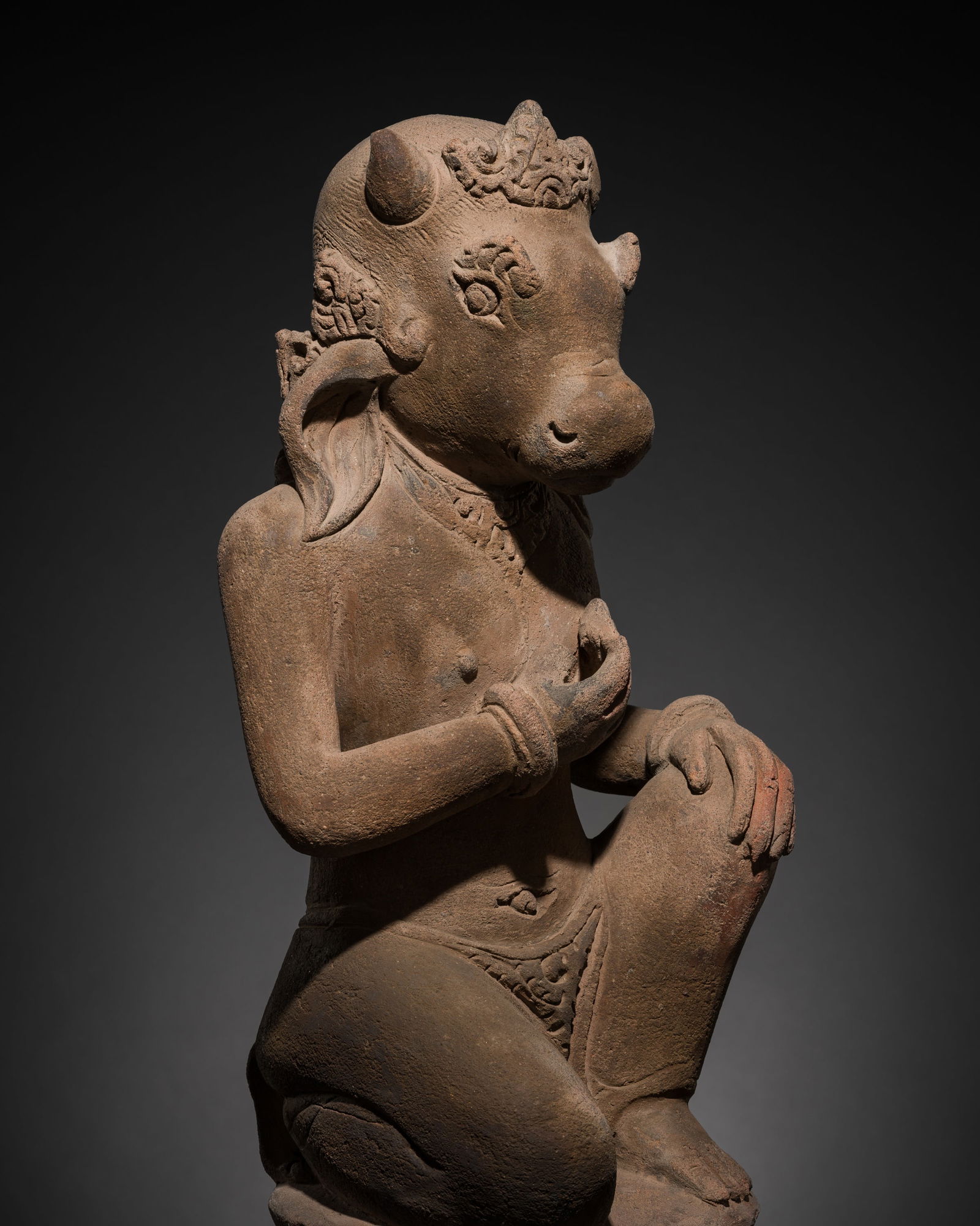 A MAJAPAHIT TERRACOTTA FIGURE OF NANDI IN HUMAN FORM: A MAJAPAHIT TERRACOTTA FIGURE OF NANDI IN HUMAN FORM This lot is from a single owner collection and is therefore offered without reserve Published: Editor Paolo Bertuz