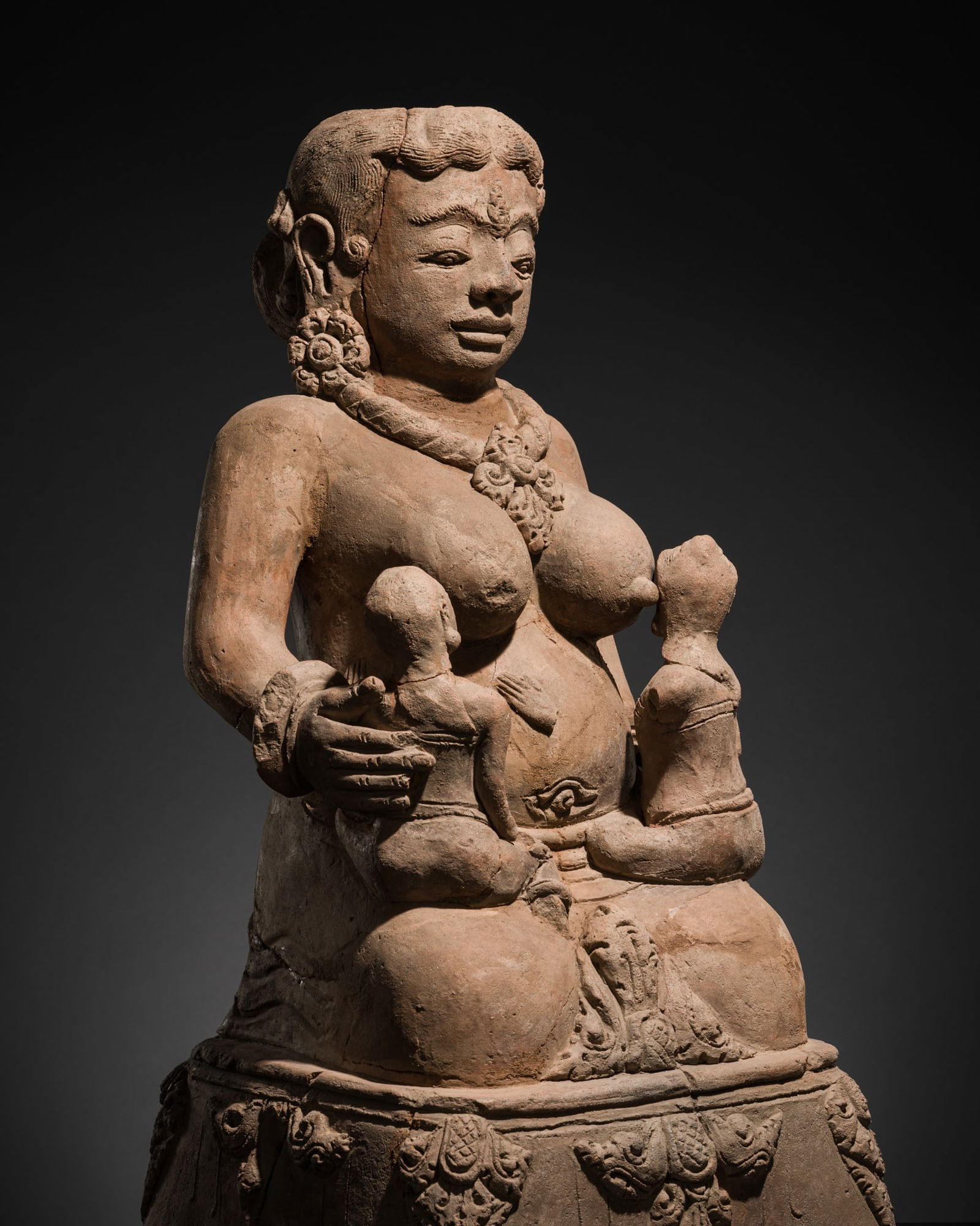 A MAJAPAHIT TERRACOTTA FIGURE OF MEN BRAJUT (HARITI) WITH CHILDREN (1 of 13)