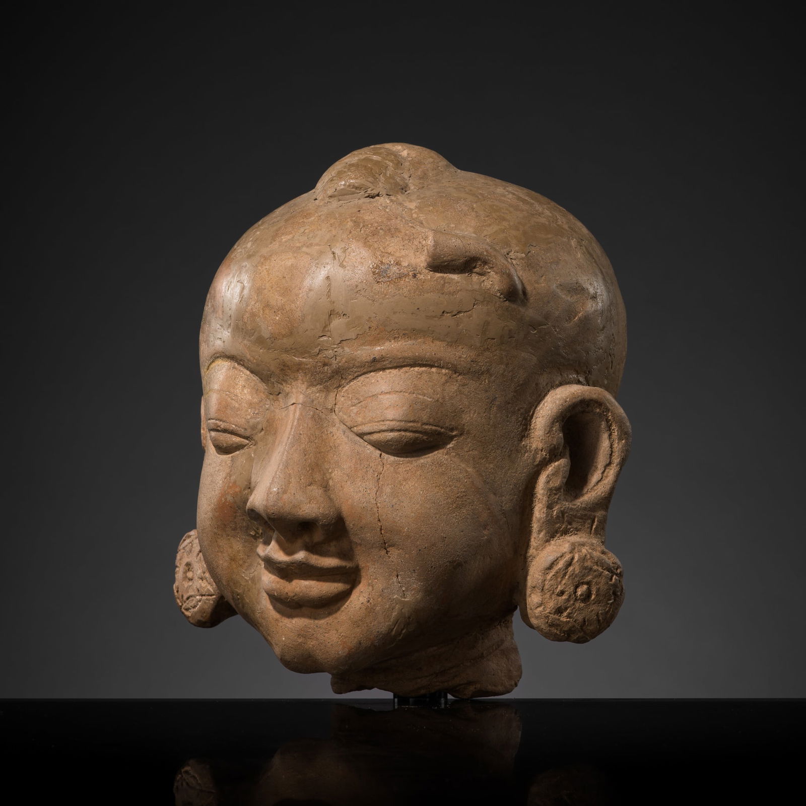 A MAJAPAHIT TERRACOTTA HEAD OF A YOUNG BOY: A MAJAPAHIT TERRACOTTA HEAD OF A YOUNG BOY This lot is from a single owner collection and is therefore offered without reserve Published: Editor Paolo Bertuzzi; Author