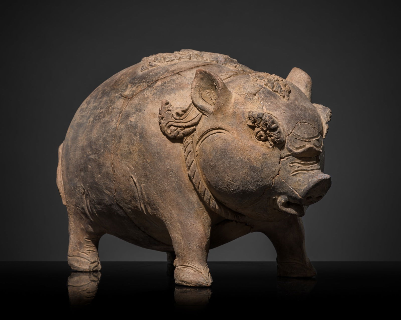 A MAJAPAHIT TERRACOTTA FIGURE OF A PIG (1 of 16)
