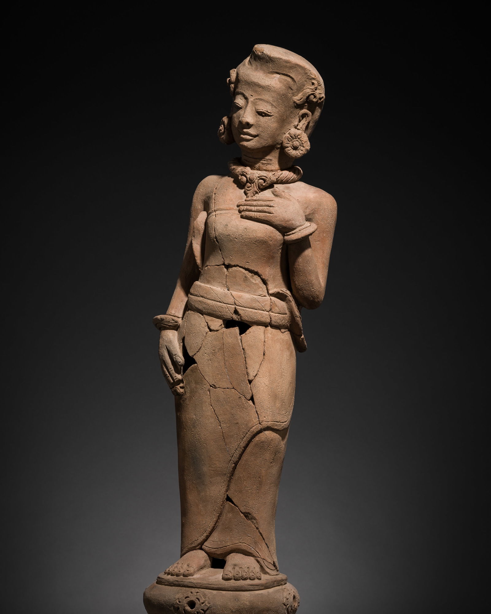 A MAJAPAHIT TERRACOTTA FIGURE OF A WIDU, DANCER (1 of 15)