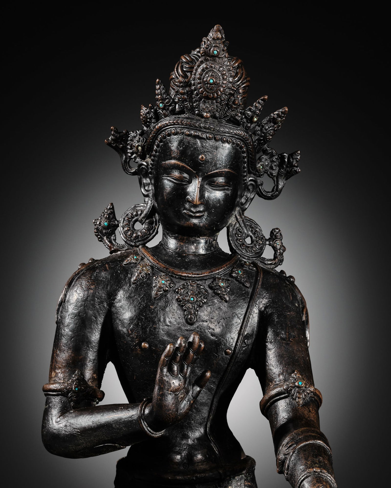 A LARGE AND IMPORTANT TURQUOISE-INLAID BRONZE FIGURE OF AVALOKITESHVARA, NEPAL, 14TH CENTURY (1 of 15)