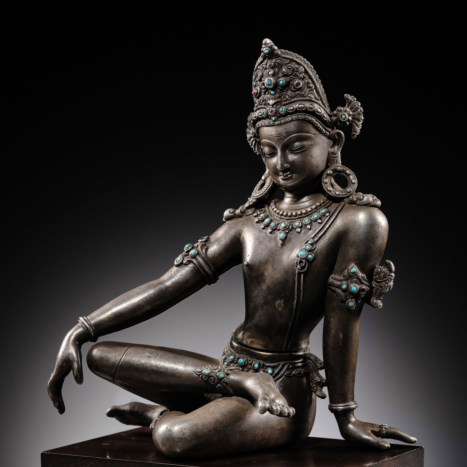 A RUBY AND TURQUOISE INLAID SILVER FIGURE OF INDRA, NEPAL, 17TH-18TH CENTURY: A RUBY AND TURQUOISE INLAID SILVER FIGURE OF INDRA, NEPAL, 17TH-18TH CENTURY Expert's Note: Larger silver figures, sometimes richly inlaid with rubies and turquoises, represent the highest level of la