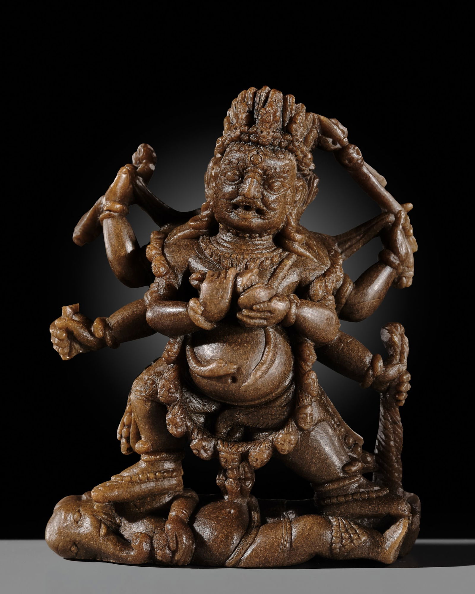 A FINELY CARVED SOAPSTONE FIGURE OF SHADBHUJA MAHAKALA, TIBET, 13TH-14TH CENTURY, EX ULRICH VON (1 of 13)