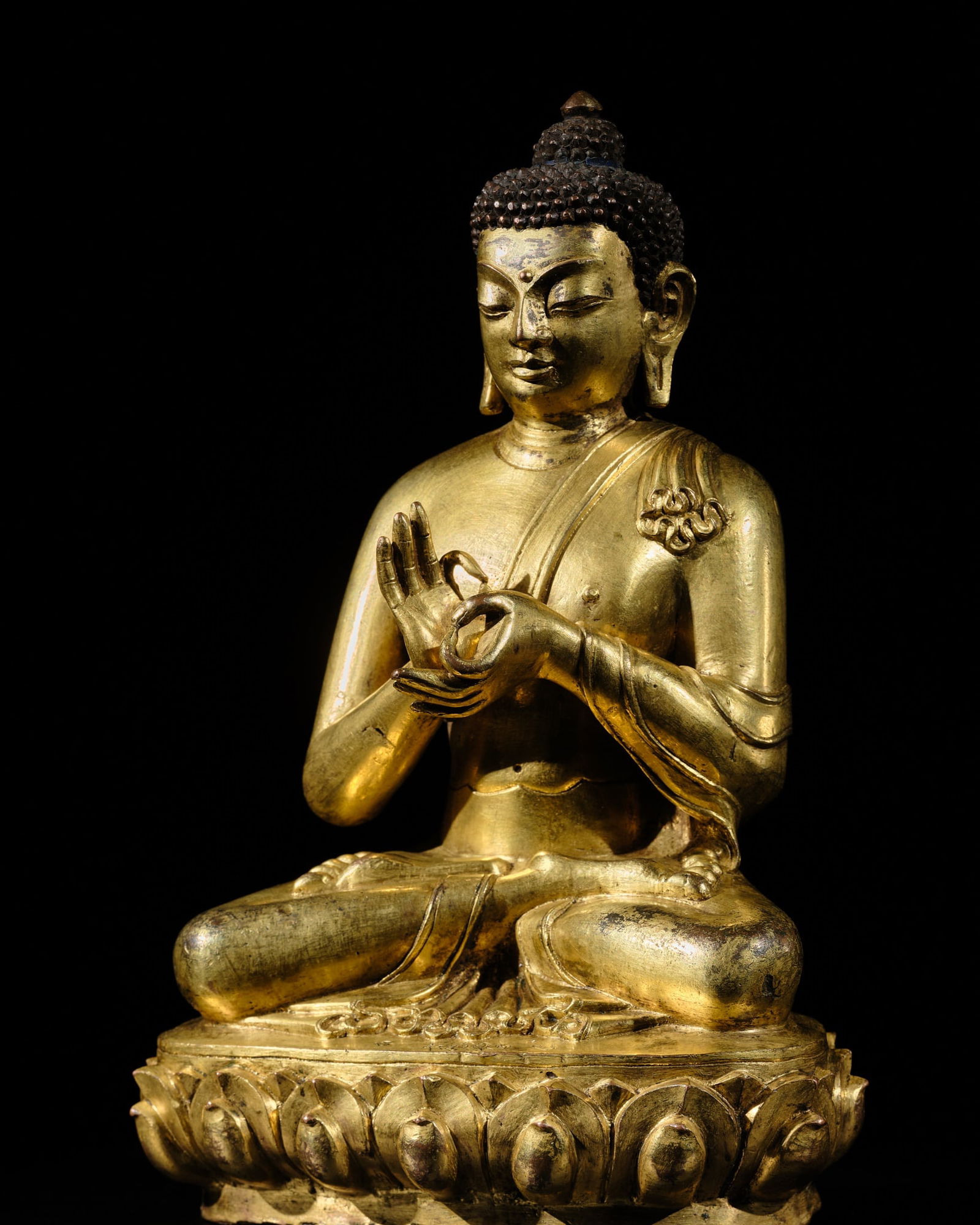 AN INSCRIBED 'MOST EXCELLENT GEM' GILT-BRONZE FIGURE OF BUDDHA DIPANKARA, TIBET, CIRCA 16TH CENTURY, (1 of 18)