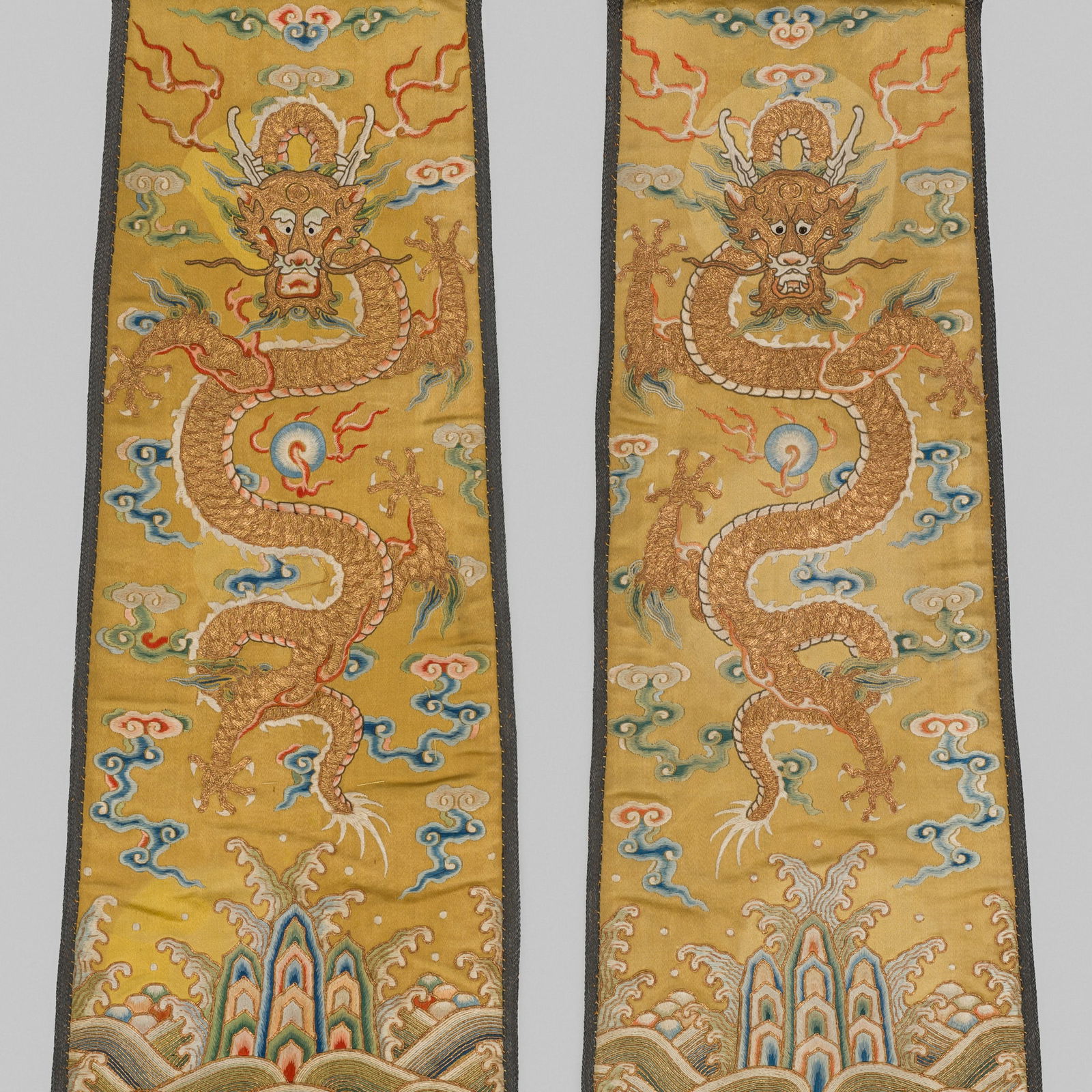 A PAIR OF IMPERIAL SILK EMBROIDERED YELLOW-GROUND 'DRAGON' PANELS, 18TH CENTURY: A PAIR OF IMPERIAL SILK EMBROIDERED YELLOW-GROUND 'DRAGON' PANELS, 18TH CENTURY Expert's note: The striking five-clawed dragons and the impeccable quality of the weaving leave no doubt that these pane