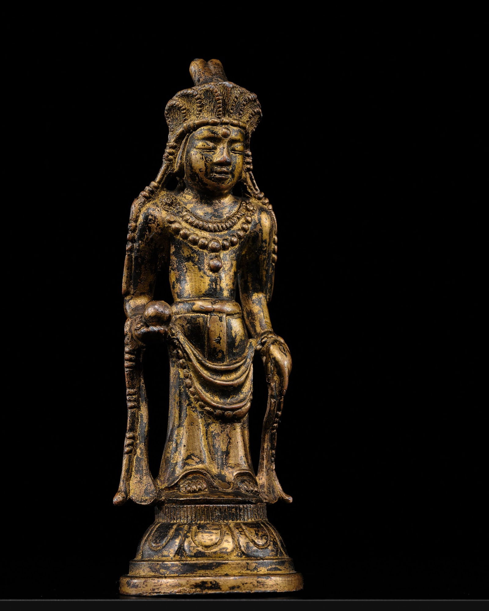 A GILT BRONZE FIGURE OF AVALOKITESHVARA, EARLY GORYEO DYNASTY, KOREA, CIRCA 10TH-12TH CENTURY: A GILT BRONZE FIGURE OF AVALOKITESHVARA, EARLY GORYEO DYNASTY, KOREA, CIRCA 10TH-12TH CENTURY Expert's note: The present figure is hollow-cast and its metallurgic composition indicates a bronze with a