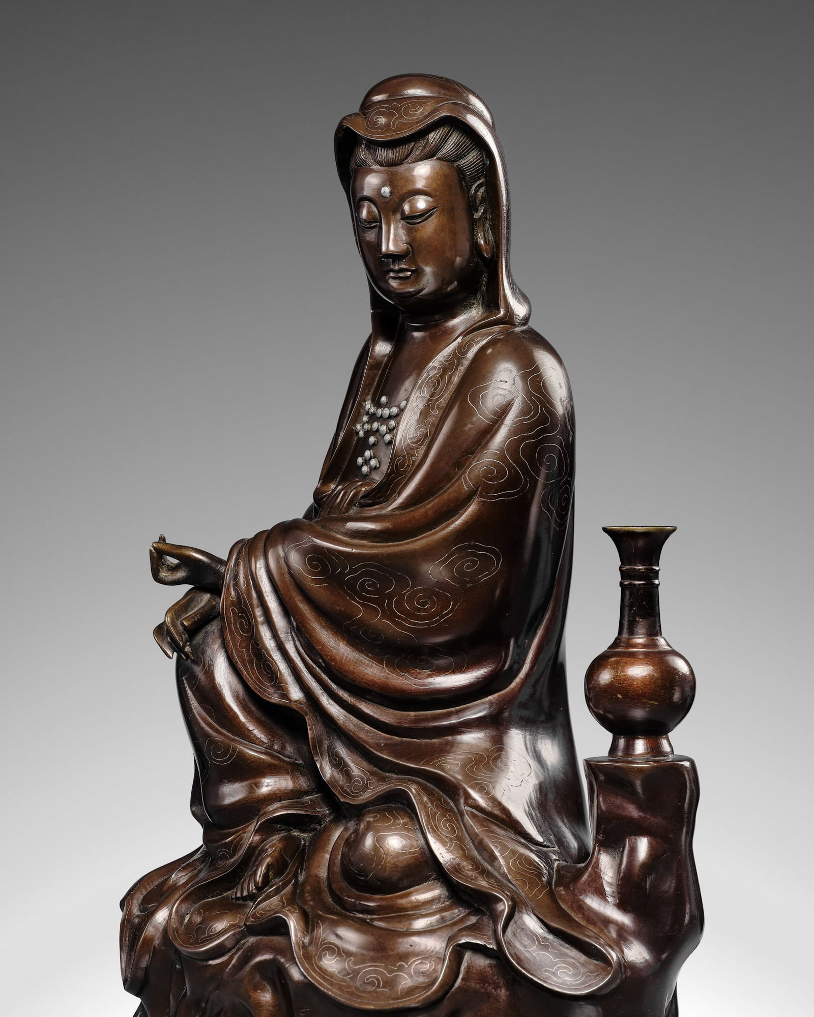 A SILVER-INLAID BRONZE FIGURE OF GUANYIN, YUTANG SHISOU MARK, LATE MING TO EARLY QING DYNASTY (1 of 15)