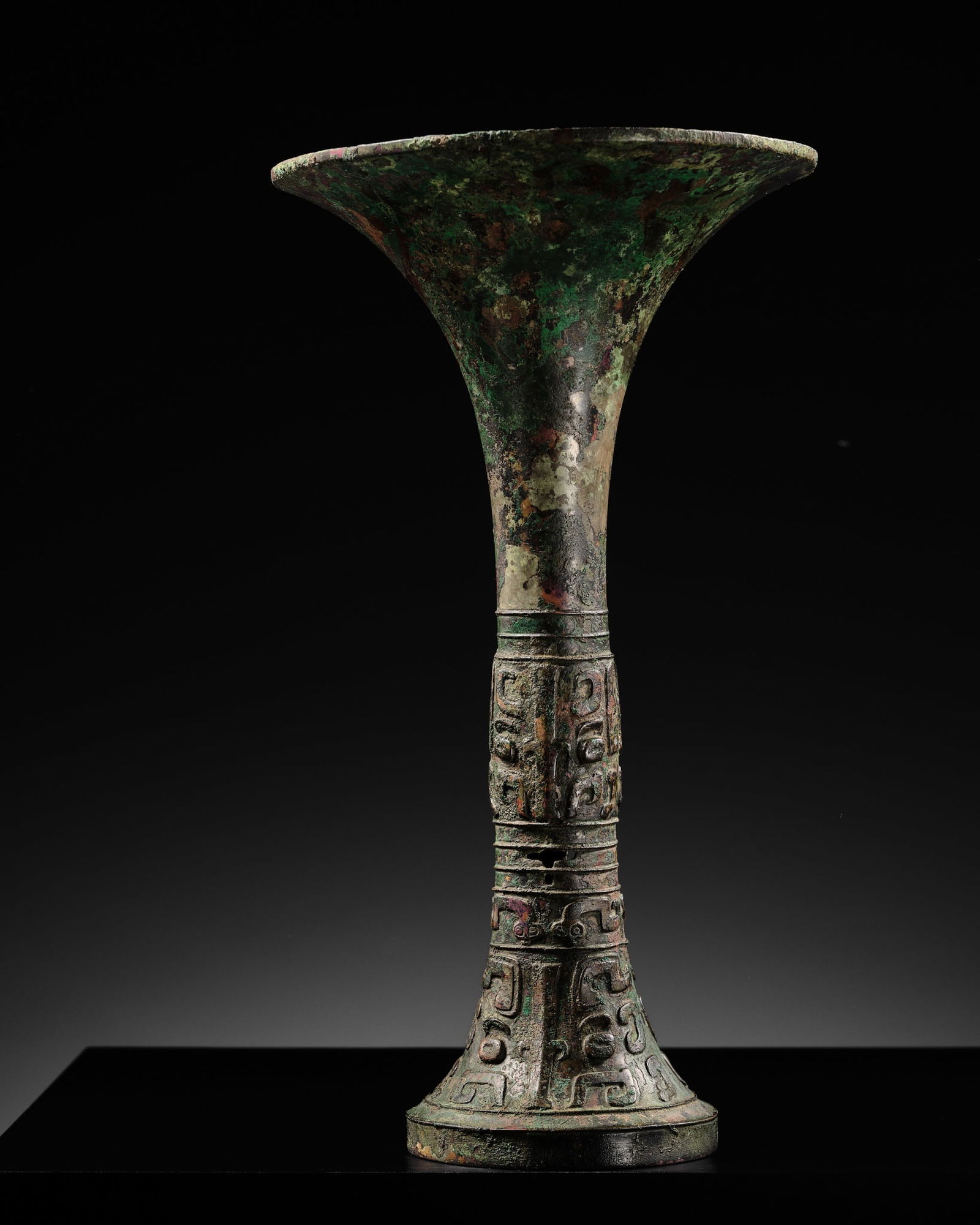 AN EXCEEDINGLY RARE BRONZE RITUAL WINE VESSEL, GU, LATE SHANG DYNASTY, ANYANG PERIOD, 12TH-11TH (1 of 19)
