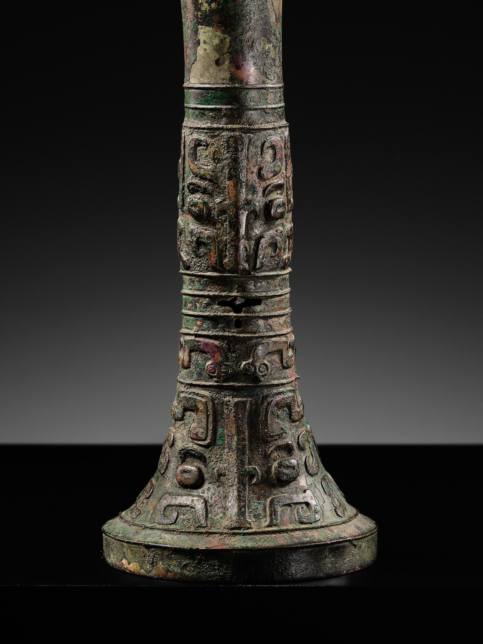 AN EXCEEDINGLY RARE BRONZE RITUAL WINE VESSEL, GU, LATE SHANG DYNASTY, ANYANG PERIOD, 12TH-11TH - 2