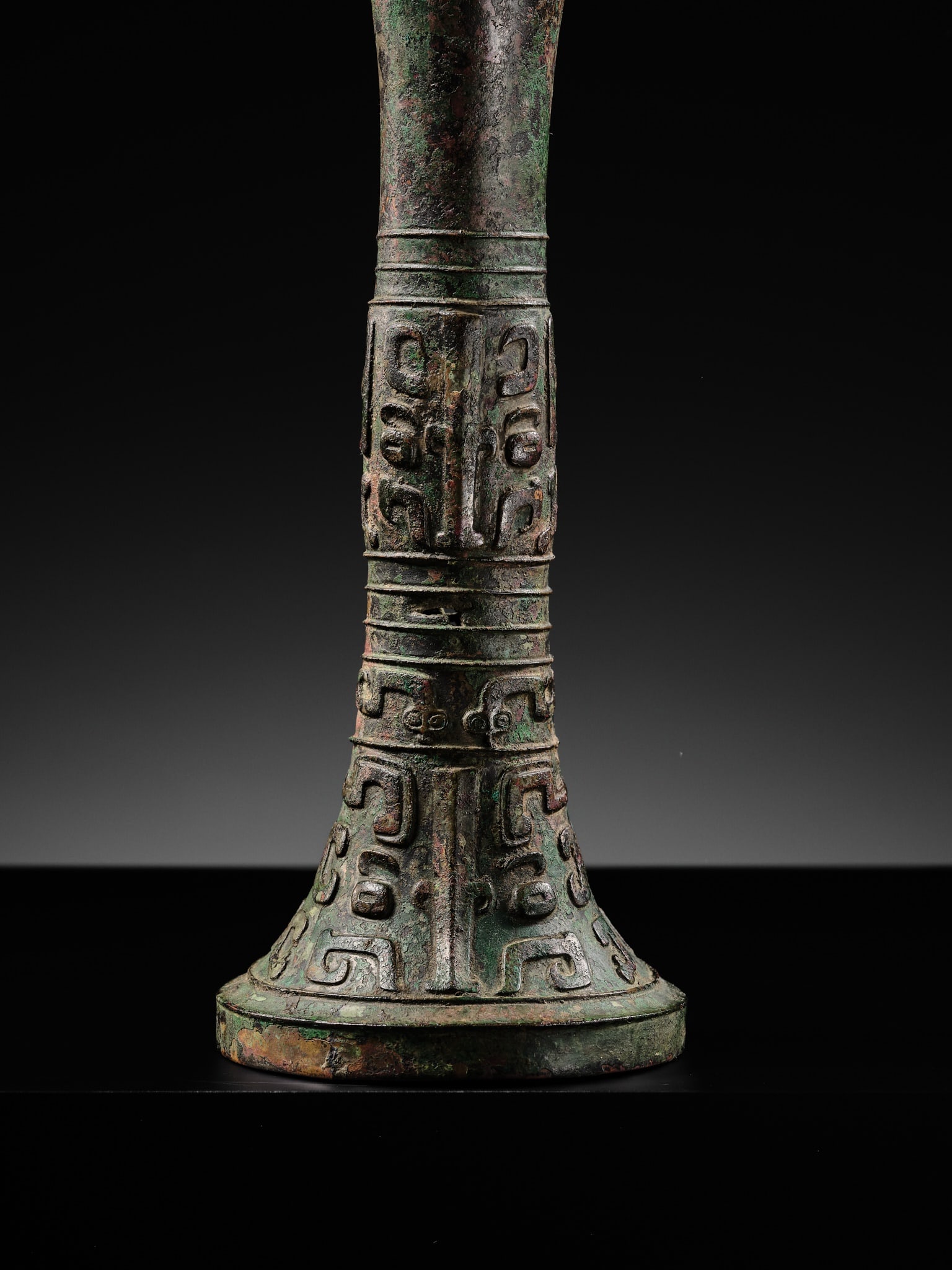 AN EXCEEDINGLY RARE BRONZE RITUAL WINE VESSEL, GU, LATE SHANG DYNASTY, ANYANG PERIOD, 12TH-11TH - 3