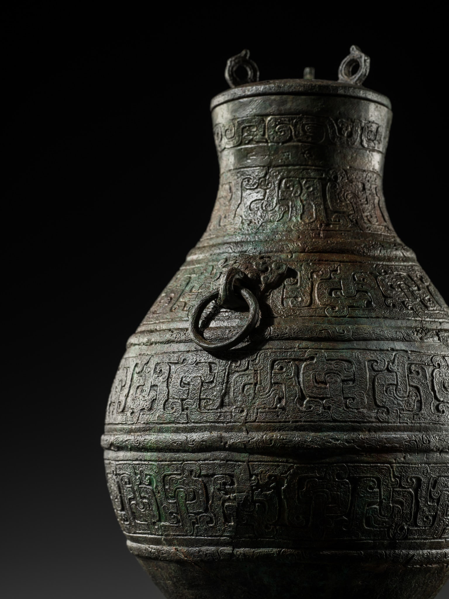 A RARE BRONZE RITUAL WINE VESSEL AND COVER, HU, WARRING STATES PERIOD, WITH TWO INSCRIPTIONS (1 of 20)
