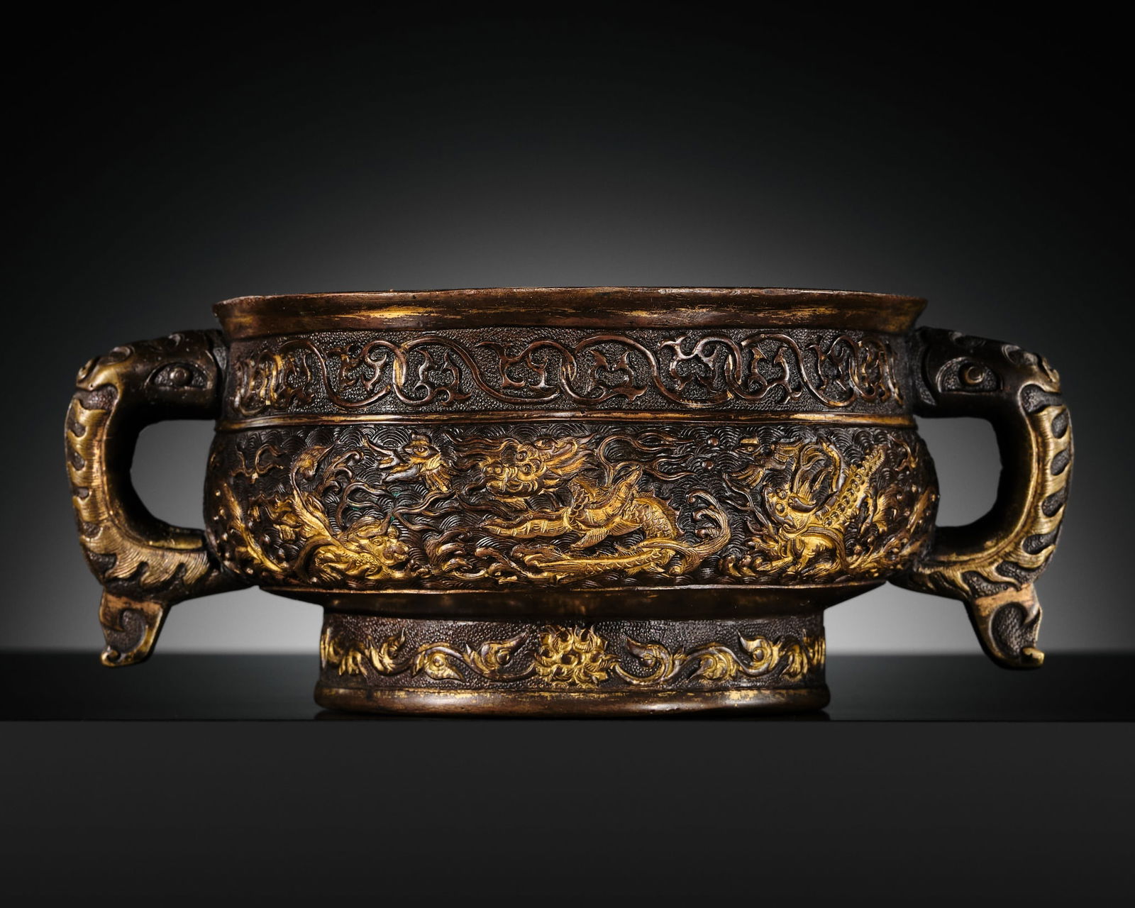 A HU WENMING PARCEL-GILT BRONZE CENSER WITH A FEIYU (FLYING FISH-DRAGON), MING DYNASTY (1 of 16)
