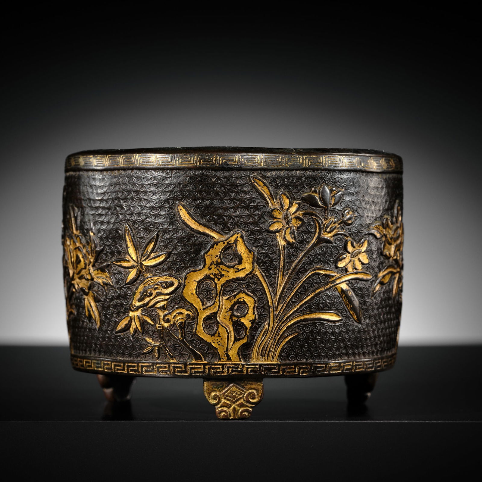 A HU WENMING PARCEL-GILT 'LINGZHI & LOTUS' BRONZE TRIPOD CENSER, MING DYNASTY (1 of 16)