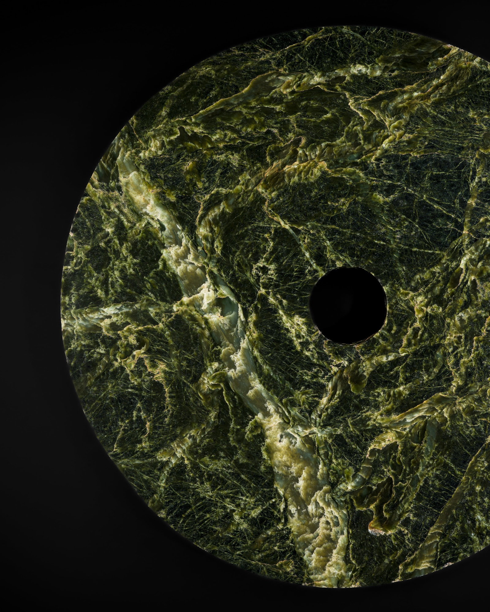 ONE OF THE LARGEST EVER FOUND JADE DISKS, BI, QIJIA CULTURE, 74 CM DIAMETER: ONE OF THE LARGEST EVER FOUND JADE DISKS, BI, QIJIA CULTURE, 74 CM DIAMETER Expert's note: The present bi disk is quite possibly the largest ever found, dwarfing any example recorded in private and pu