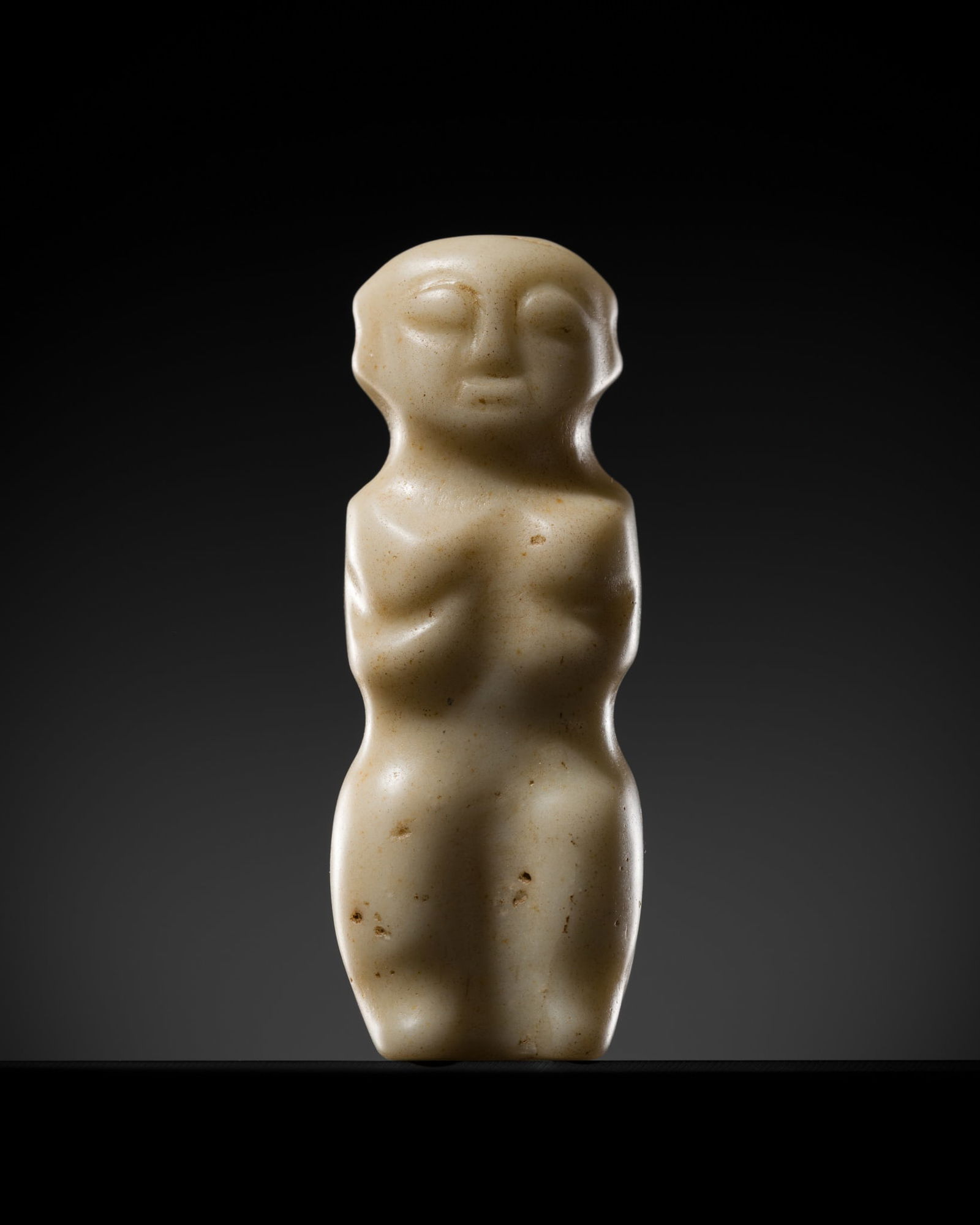 AN ARCHAIC WHITE JADE 'HUMANOID' PENDANT, NEOLITHIC PERIOD, HONGSHAN CULTURE: AN ARCHAIC WHITE JADE 'HUMANOID' PENDANT, NEOLITHIC PERIOD, HONGSHAN CULTURE Expert authentication: Dr. Gu Fang has examined the present lot and confirms its authenticity and the dating above, noting