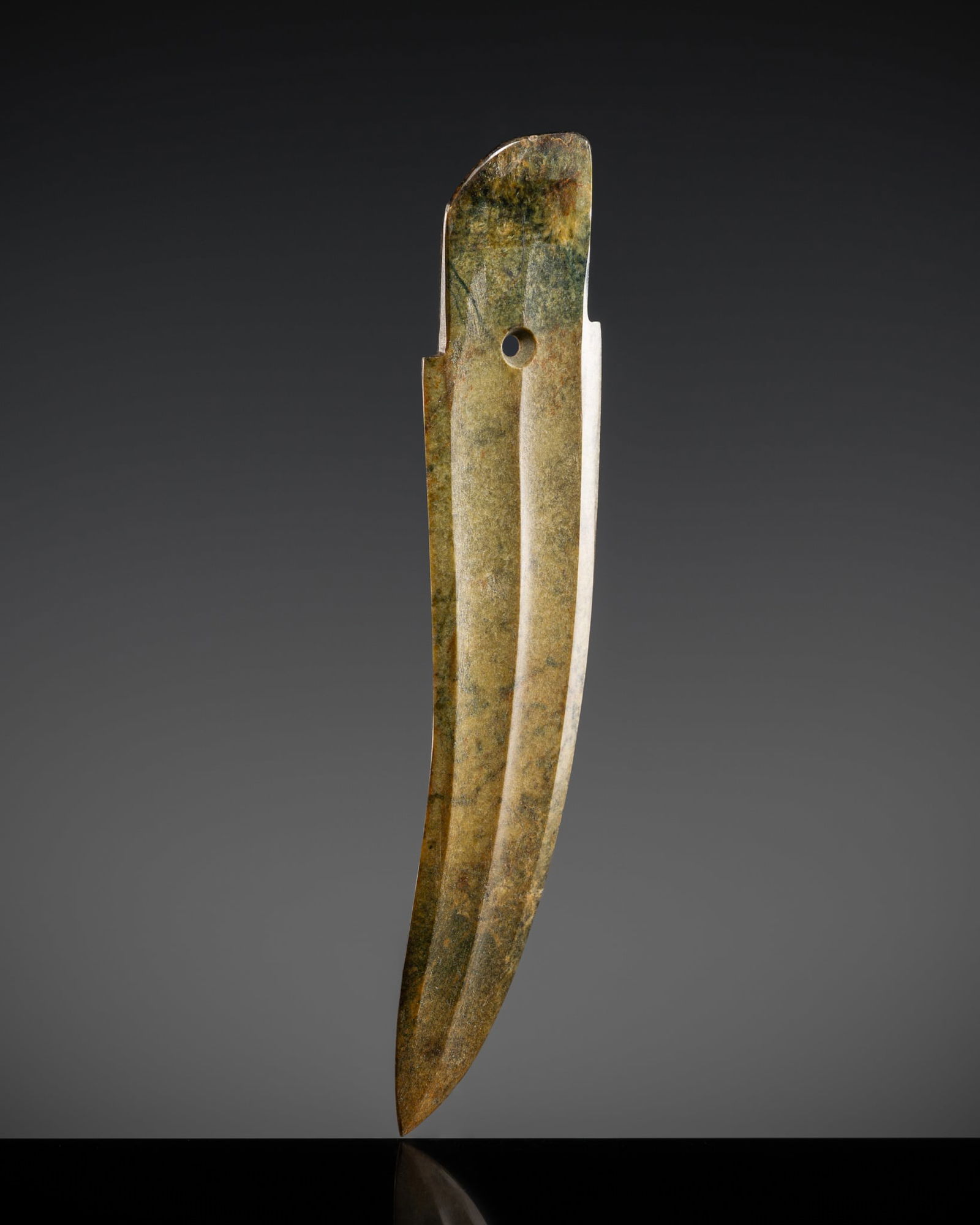 A FINE MOTTLED GREEN JADE CEREMONIAL DAGGER, GE, LATE SHANG DYNASTY (1 of 14)