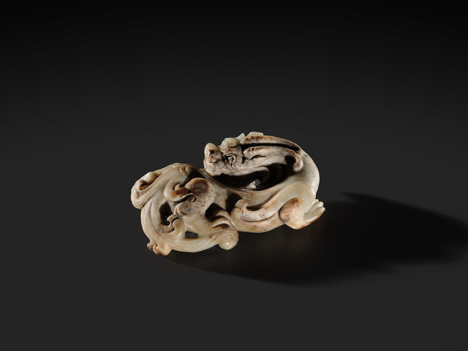 AN EXCEPTIONAL AND POWERFULLY CARVED WHITE AND BROWN JADE CARVING OF A BIXIE, WESTERN HAN DYNASTY - 12