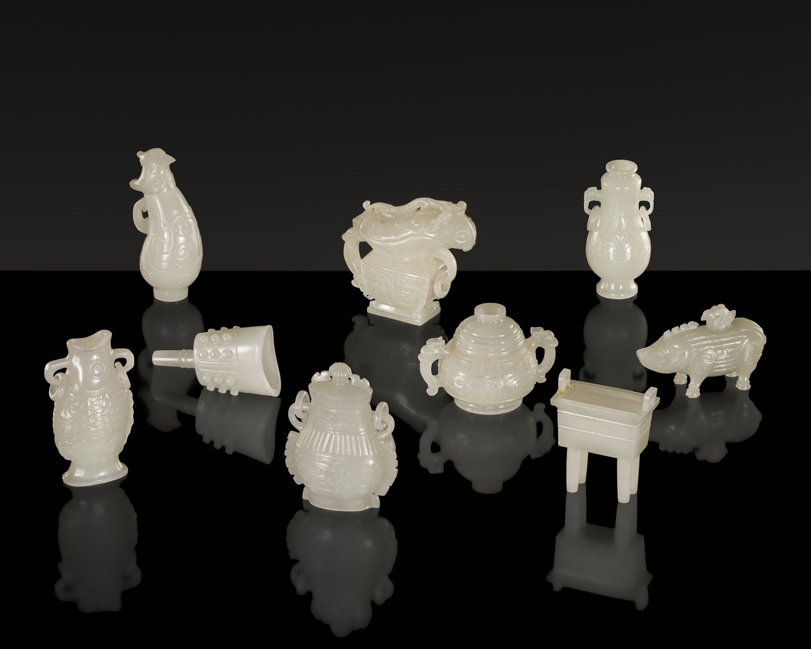 A SET OF NINE ARCHAISTIC MINIATURE WHITE JADE VESSELS FOR AN IMPERIAL TREASURE BOX, 18TH-19TH (1 of 20)