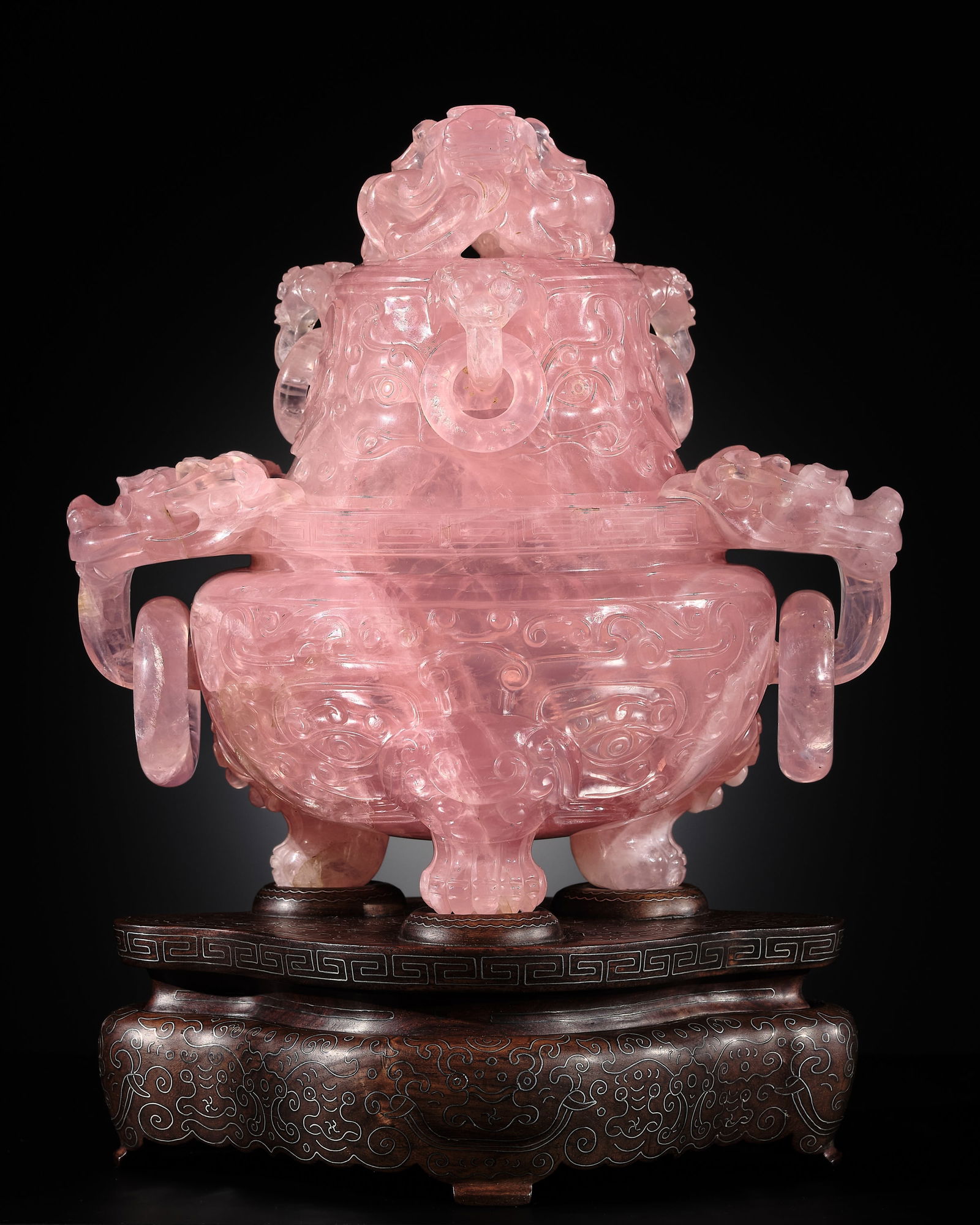 AN IMPERIAL ROSE QUARTZ TRIPOD CENSER AND COVER, QIANLONG PERIOD: AN IMPERIAL ROSE QUARTZ TRIPOD CENSER AND COVER, QIANLONG PERIOD Expert's note:The translucent stone is of a spectacular deep pink color with scattered white and light pink inclusions. The brilliance