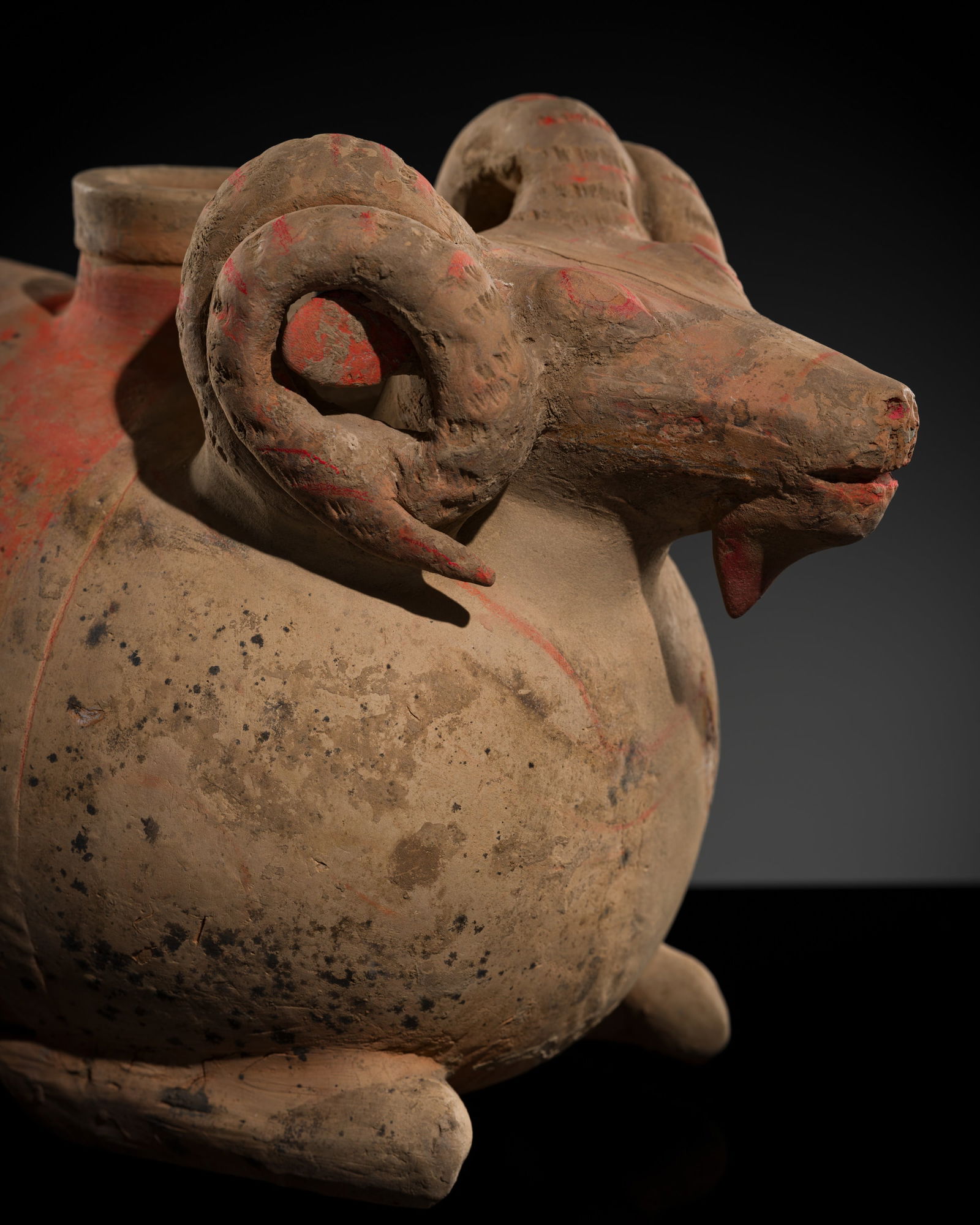 A LARGE PAINTED POTTERY 'RAM' VESSEL, ZUN, HAN DYNASTY: A LARGE PAINTED POTTERY 'RAM' VESSEL, ZUN, HAN DYNASTY Scientific Analysis Report: A thermoluminescence analysis report issued by Alliance-Science-Art on 8 October 1994, based on reference number 14.1