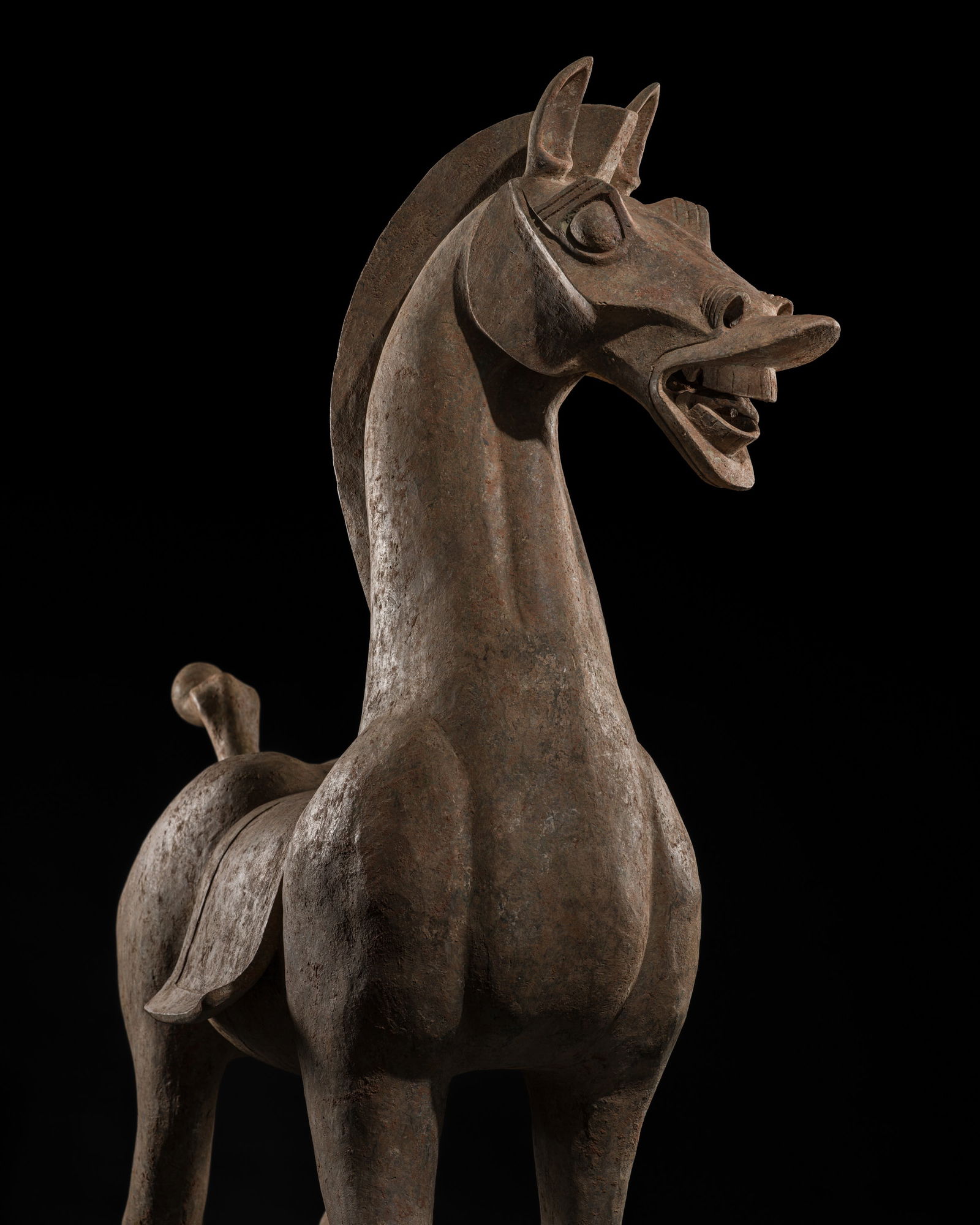 A MONUMENTAL AND HIGHLY IMPORTANT SICHUAN POTTERY HORSE, HAN DYNASTY, THE LARGEST EVER RECORDED FROM: A MONUMENTAL AND HIGHLY IMPORTANT SICHUAN POTTERY HORSE, HAN DYNASTY, THE LARGEST EVER RECORDED FROM THIS GROUP Expert's note:The present lot is the largest Han-dynasty pottery horse of this monumenta