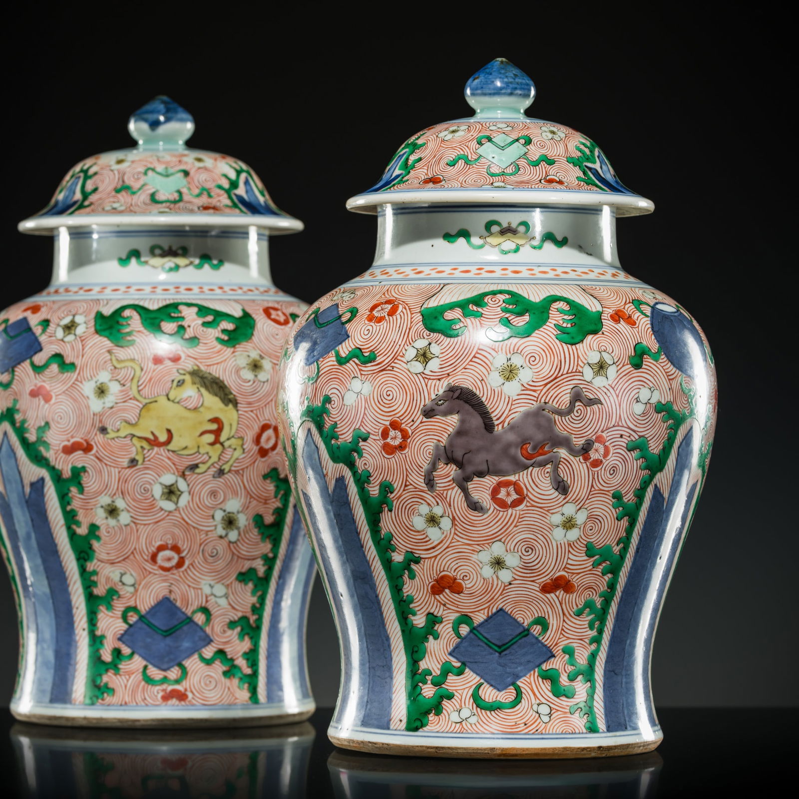 A RARE PAIR OF ABSOLUTELY PERFECT WUCAI 'HEAVENLY HORSES' JARS AND COVERS, LATE KANGXI TO YONGZHENG (1 of 20)