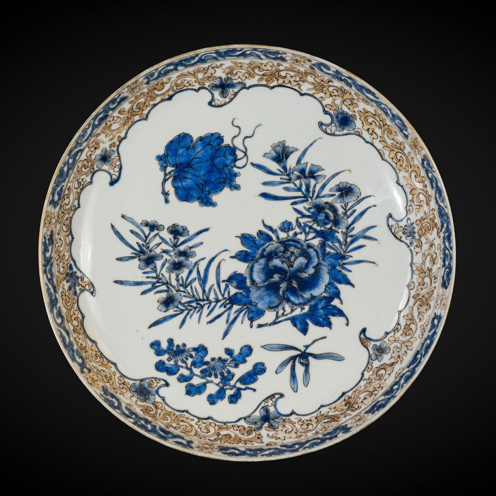 THE EX-MORGAN AND PALMER EGGSHELL PORCELAIN 'PEONY' DISH, 18TH CENTURY: THE EX-MORGAN AND PALMER EGGSHELL PORCELAIN 'PEONY' DISH, 18TH CENTURY China. Delicately potted, the shallow dish finely decorated in gilt and blue enamels to the well with sprays of peony, chrysanthe