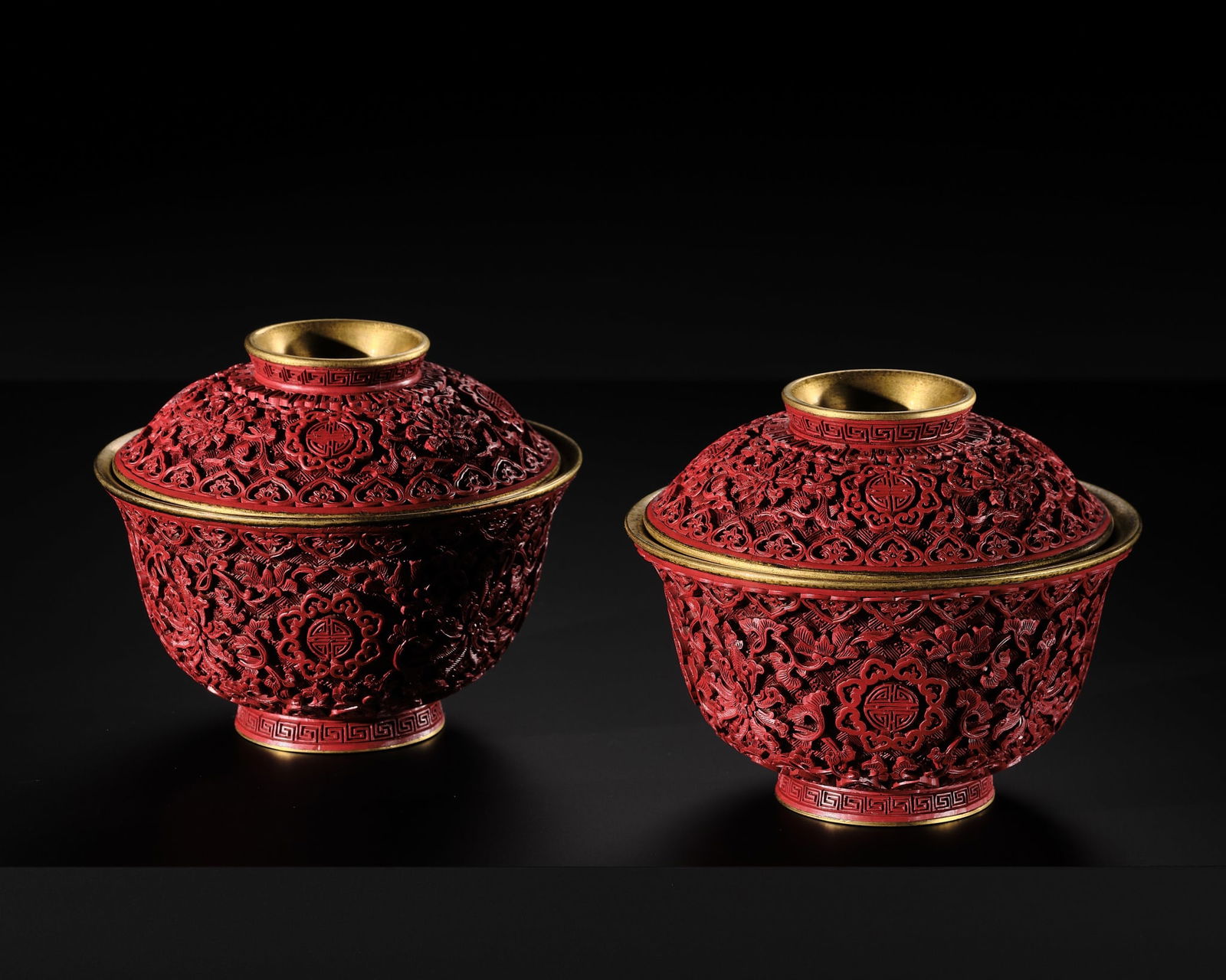AN EXTREMELY RARE PAIR OF RICHLY GILT IMPERIAL BRONZE AND CINNABAR LACQUER 'SHOU' BOWLS AND COVERS, (1 of 17)