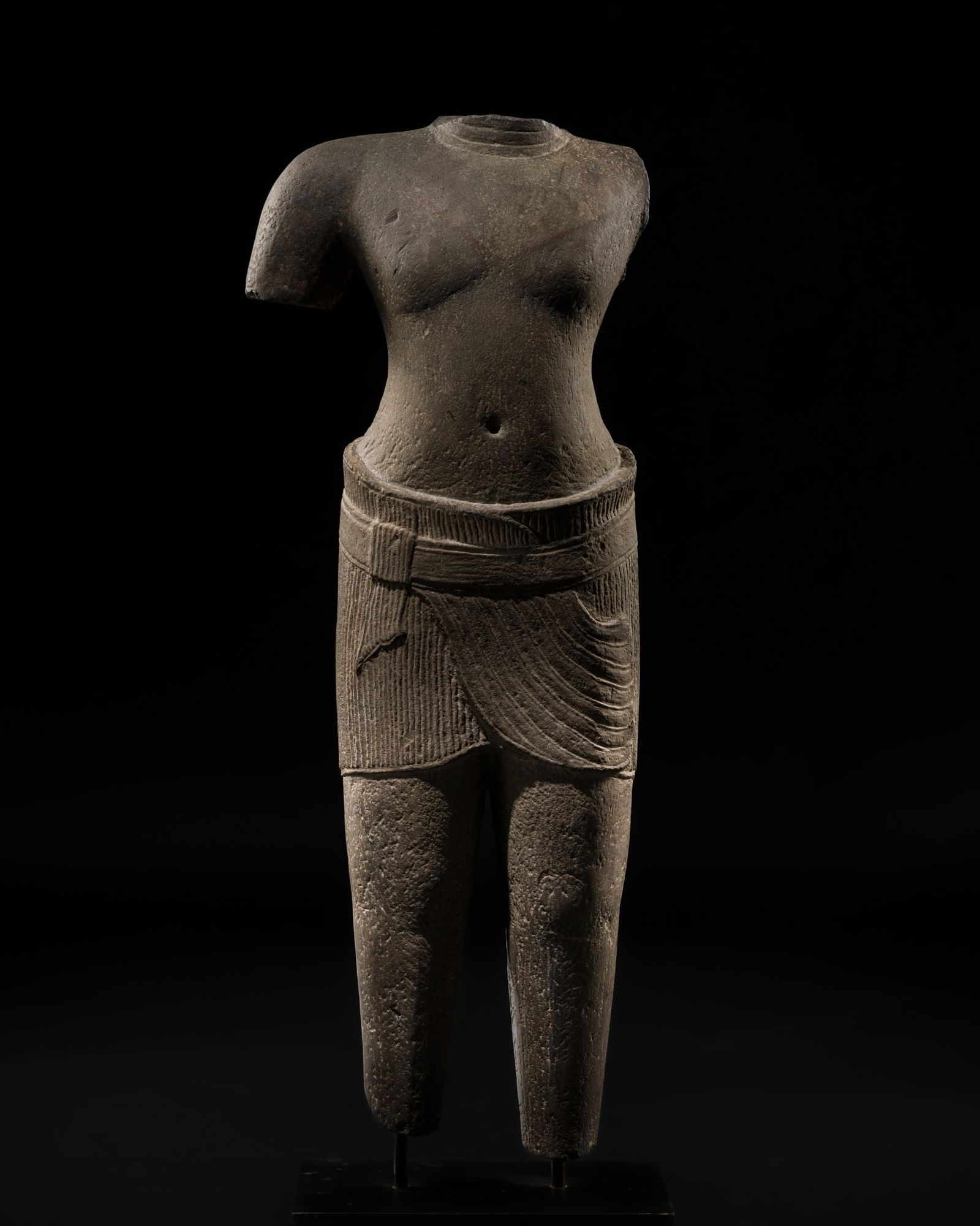 A SANDSTONE FIGURE OF A MALE DEITY, ANGKOR PERIOD, ANGKOR WAT STYLE, 12TH CENTURY (1 of 14)