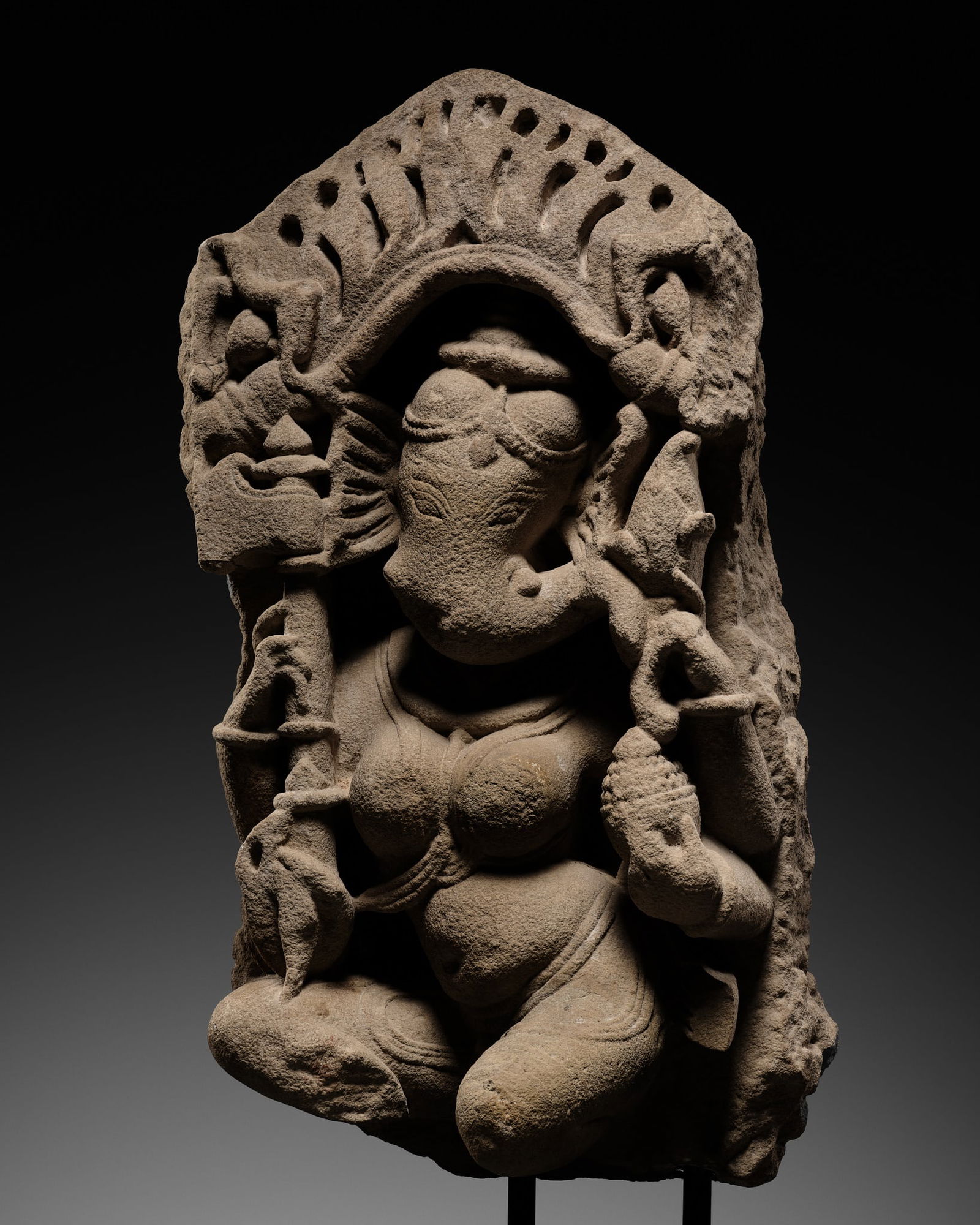 A RARE SANDSTONE FIGURE OF VINAYAKI, THE FEMALE FORM OF GANESHA, RAJASTHAN OR MADHYA PRADESH,: A RARE SANDSTONE FIGURE OF VINAYAKI, THE FEMALE FORM OF GANESHA, RAJASTHAN OR MADHYA PRADESH, 10TH-12TH CENTURY Expert's note:Images of Vinayaki are exceptionally rare. She is the elephant-headed fema