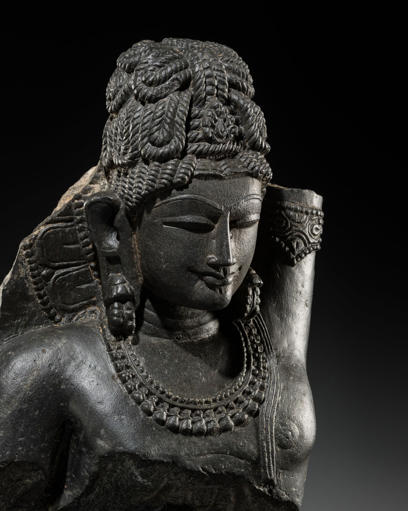 A CHLORITIC SCHIST FRAGMENT OF KRISHNA LIFTING MOUNT GOVARDHAN, HOYSALA DYNASTY (1000-1346), (1 of 13)