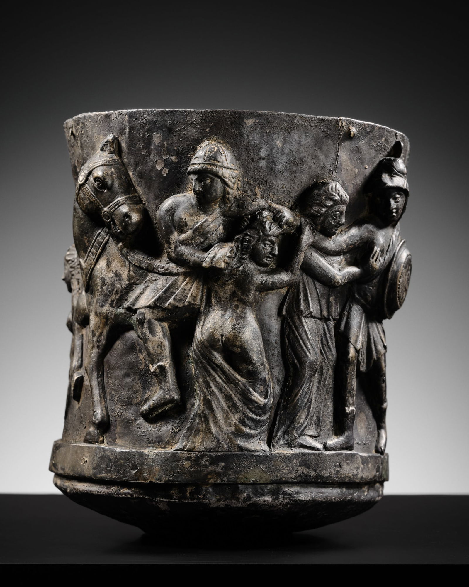 A LARGE SILVER REPOUSSÉ GOBLET DEPICTING THE ABDUCTION OF WOMEN, ANCIENT REGION OF GANDHARA,: A LARGE SILVER REPOUSSÉ GOBLET DEPICTING THE ABDUCTION OF WOMEN, ANCIENT REGION OF GANDHARA, CIRCA 1ST-4TH CENTURY The large vessel raised on a short circular foot and rising to a gently flaring
