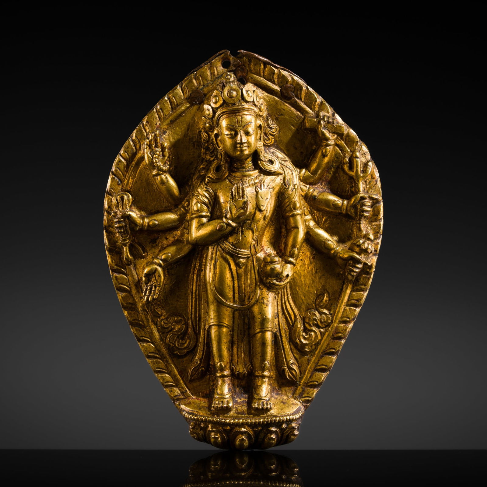 A GILT-COPPER ALLOY REPOUSSÉ PLAQUE OF AMOGHAPASHA, NEPAL, CIRCA 17TH CENTURY (1 of 16)