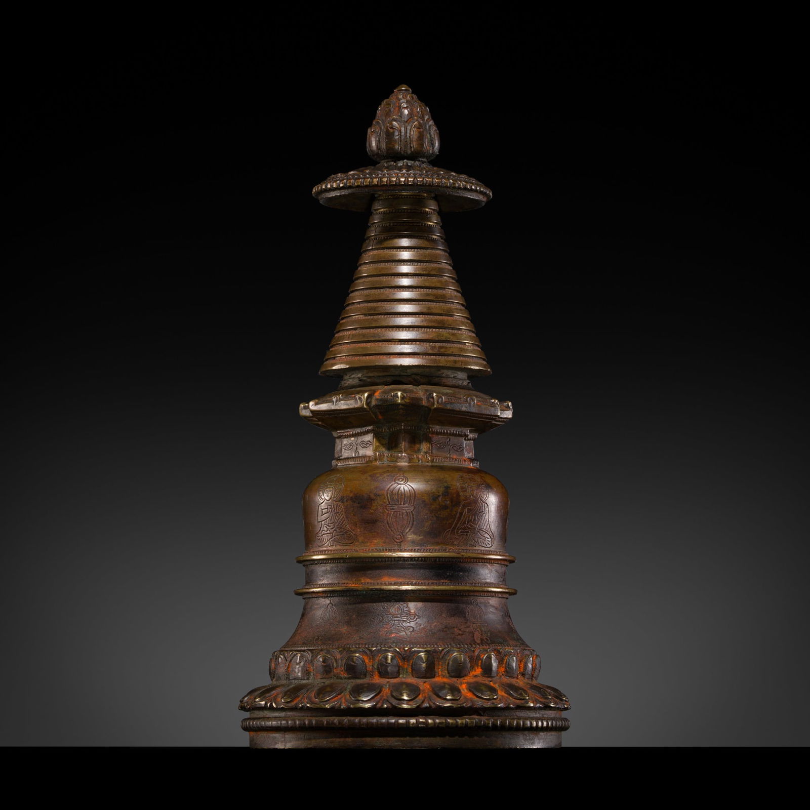 AN INSCRIBED BRONZE STUPA, KADAMPA STYLE, TIBET, 16TH CENTURY OR EARLIER (1 of 17)