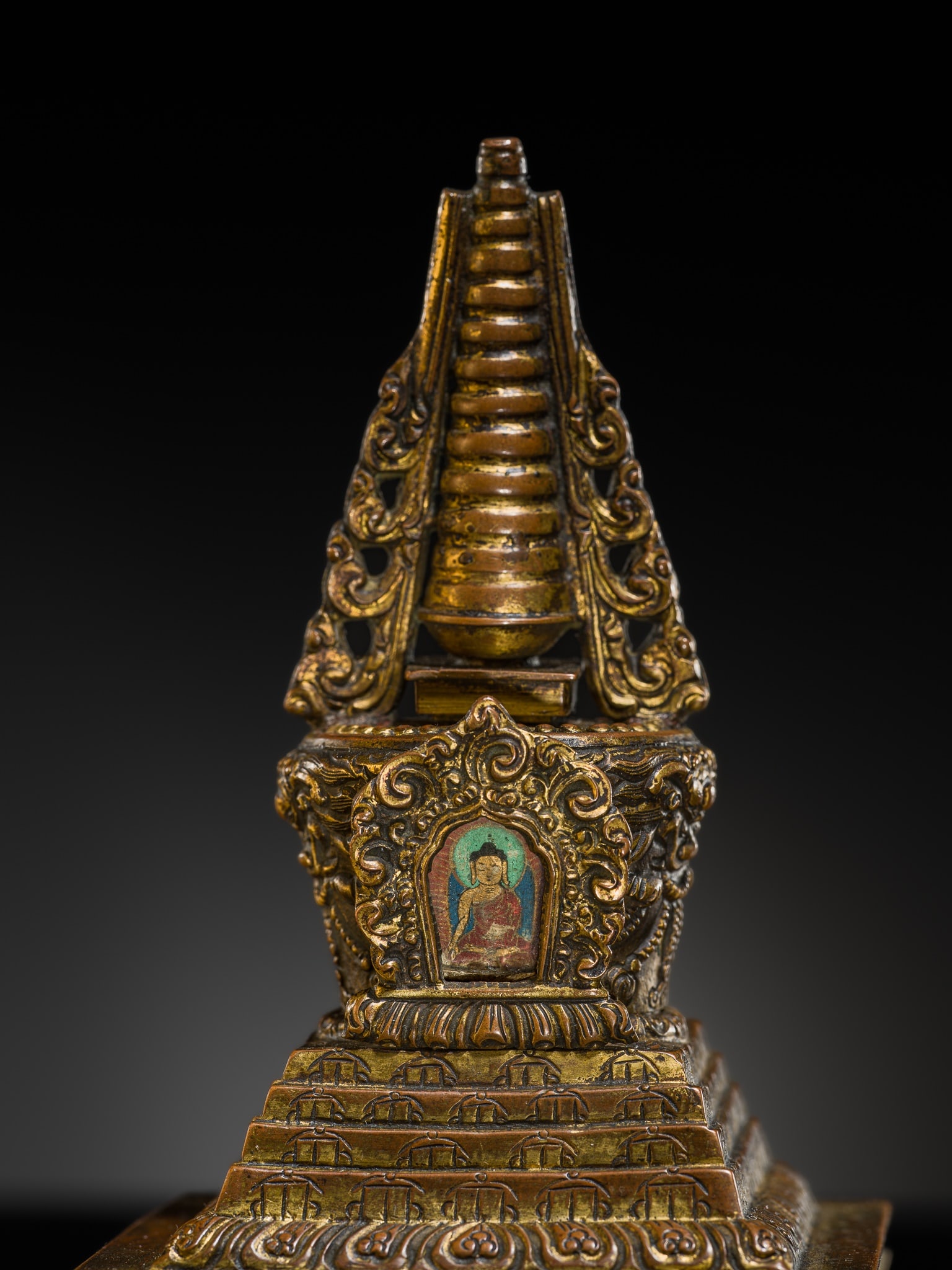 A GILT-COPPER ALLOY STUPA OF MANY DOORS, 18TH CENTURY (1 of 13)