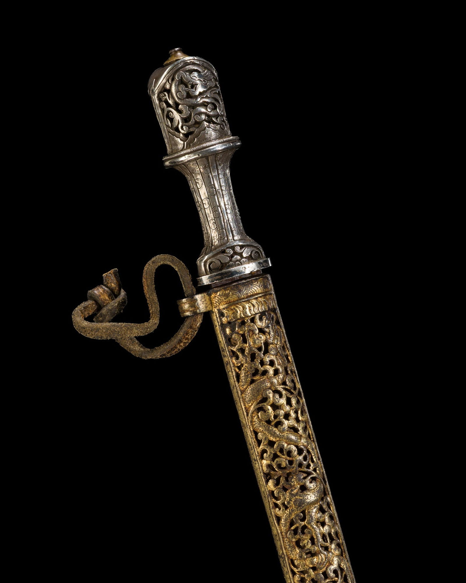 A SILVER-HILTED IRON DAGGER WITH SILVER- AND GILT-DAMASCENED IRON SCABBARD, TIBET, 18TH-19TH CENTURY (1 of 15)