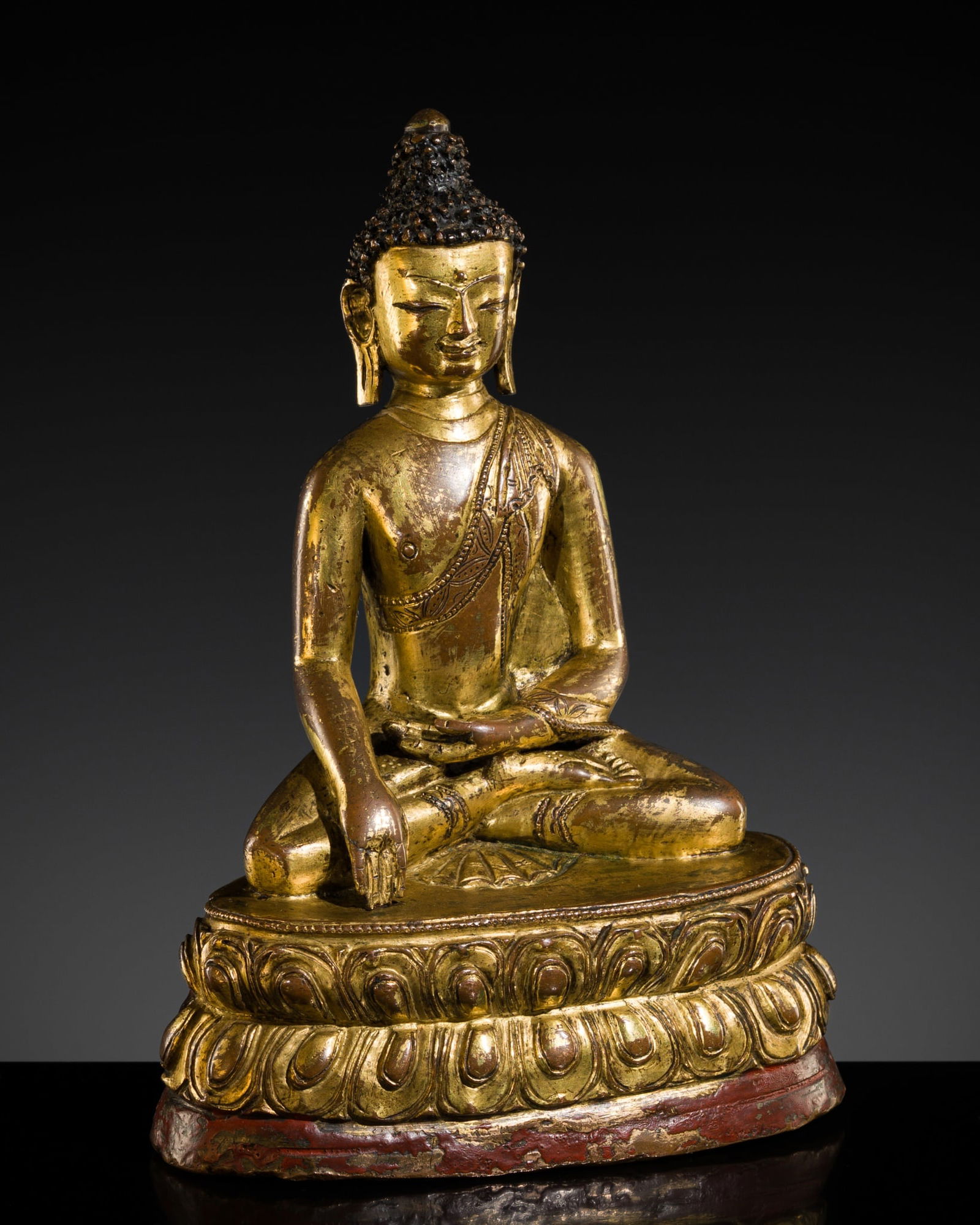 A GILT-BRONZE FIGURE OF BUDDHA SHAKYAMUNI, TIBET, 15TH CENTURY (1 of 10)