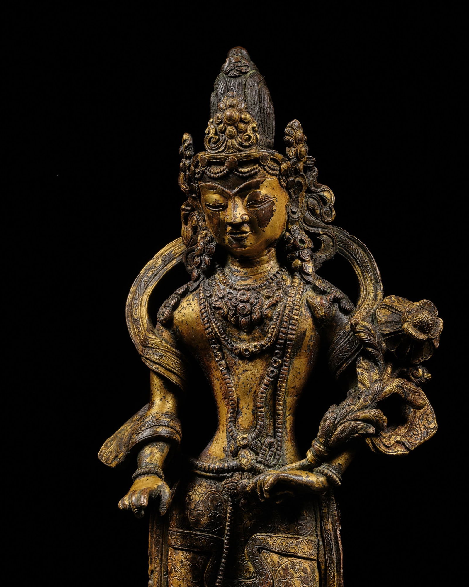 A CRYSTAL-INLAID GILT-COPPER ALLOY FIGURE OF PADMAPANI, NEPAL, 17TH CENTURY (1 of 12)